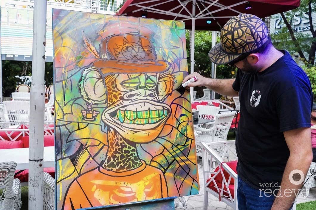 Roc Sol painting bored ape canvases live at Miami Web3 Happy Hour in Miami Beach Magic City Apes World Red Eye