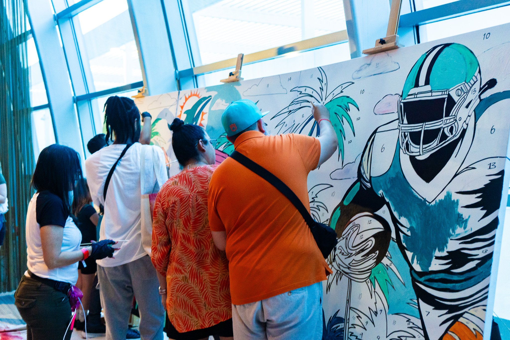 Paint by Numbers mural experience in Miami for the Super Bowl LIX Verizon FanFest Miami Dolphins by Roc Sol Project Roadmap Dee Perez Miss Lushy Miami muralist artist