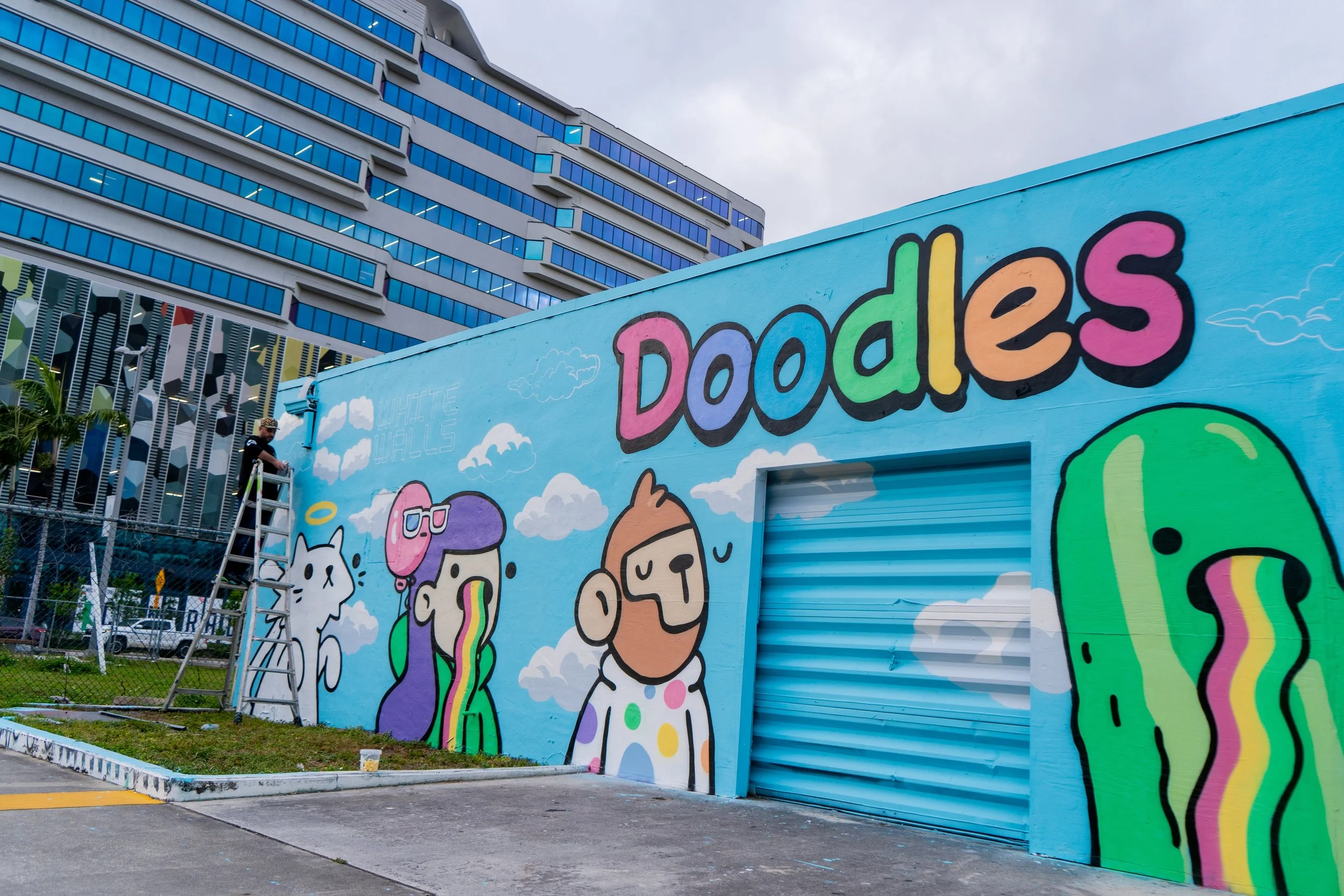 Doodles Mural - White Walls Mural - Miami Wynwood Midtown Miami Murals - Painted by Roc Sol and Dee Perez from Project Roadmap Murals - Wynwood Walls - Wynwood Mural - Miami Murals - Doodles NFT Mural - Pharrell Williams - Blondie White Walls App