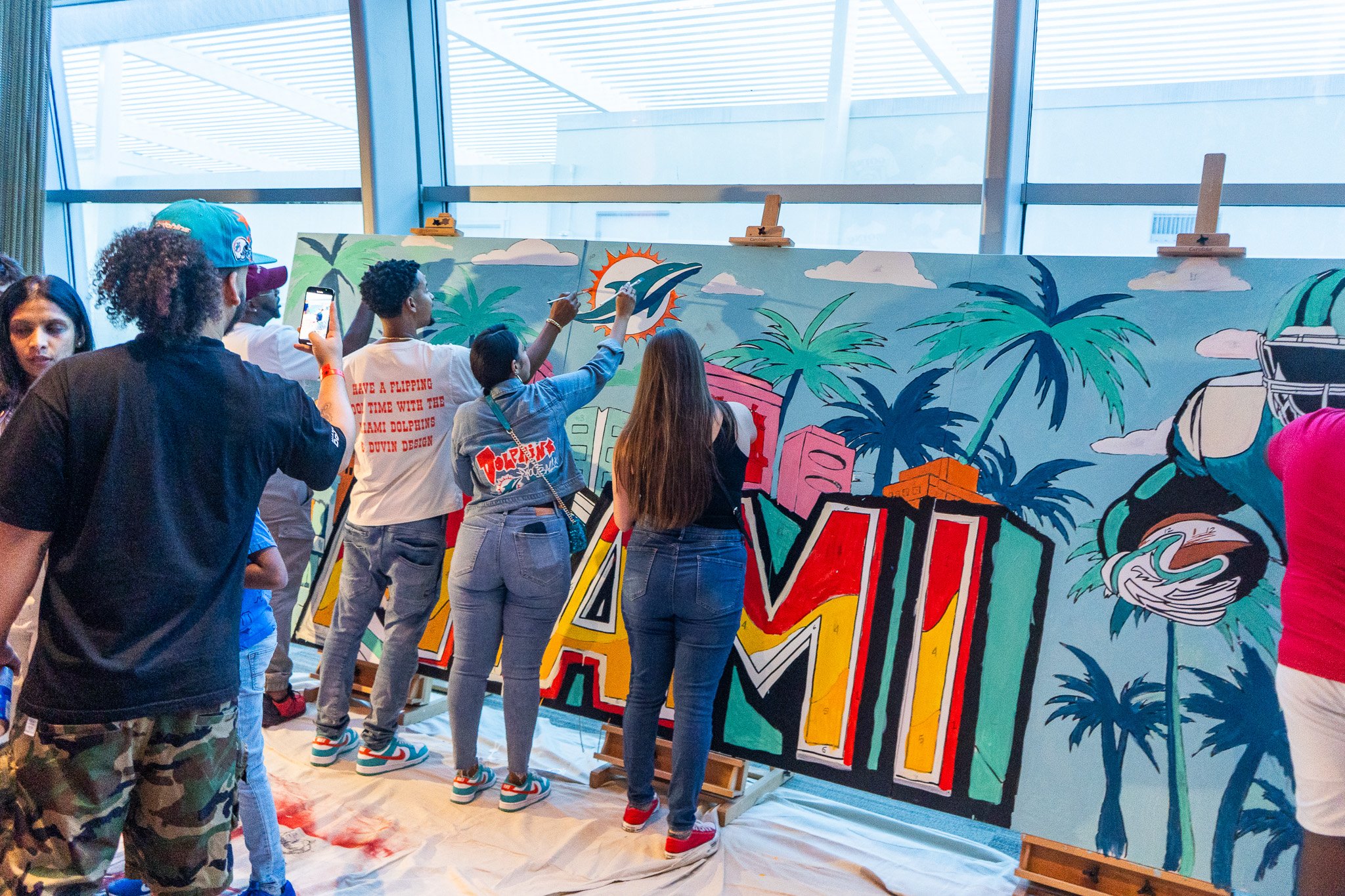Paint by Numbers mural experience in Miami for the Super Bowl LIX Verizon FanFest Miami Dolphins by Roc Sol Project Roadmap Dee Perez Miss Lushy Miami muralist artist