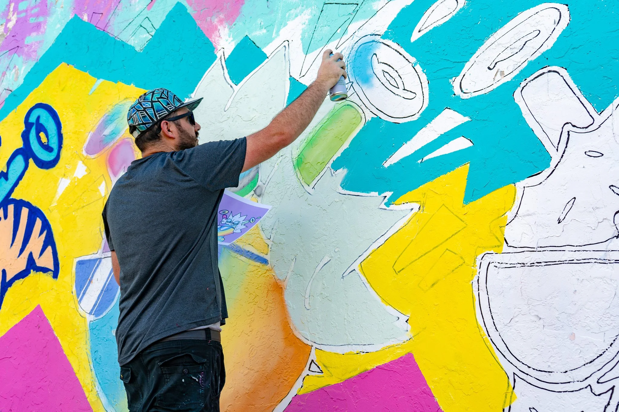 Miami Muralist Roc Sol painting Quirkies NFT Mural in Wynwood Street Art