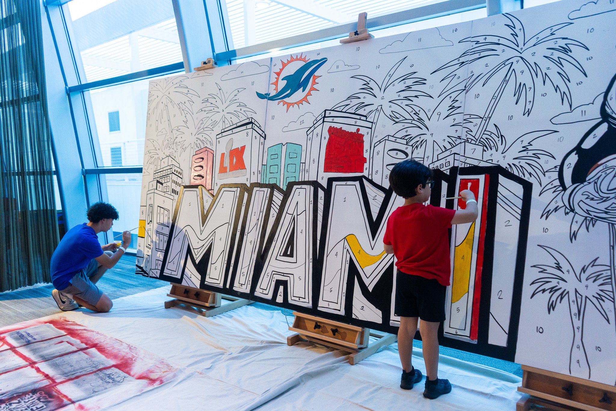 Paint by Numbers mural experience in Miami for the Super Bowl LIX Verizon FanFest Miami Dolphins by Roc Sol Project Roadmap Dee Perez Miss Lushy Miami muralist artist