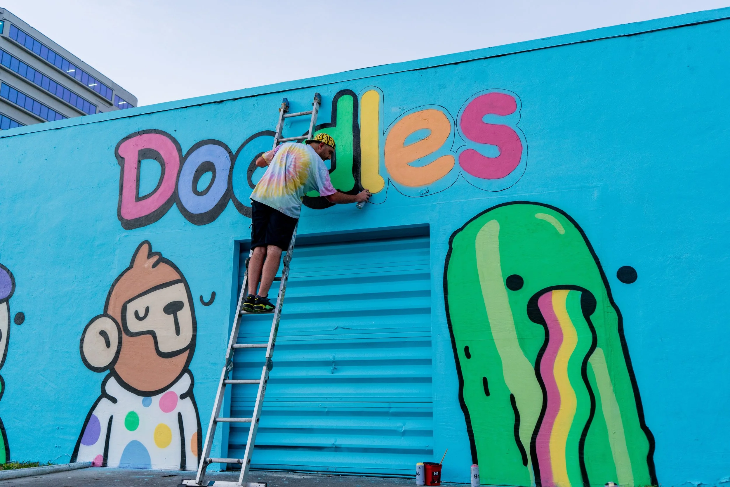 Doodles Mural - White Walls Mural - Miami Wynwood Midtown Miami Murals - Painted by Roc Sol and Dee Perez from Project Roadmap Murals - Wynwood Walls - Wynwood Mural - Miami Murals - Doodles NFT Mural - Pharrell Williams - Blondie White Walls App