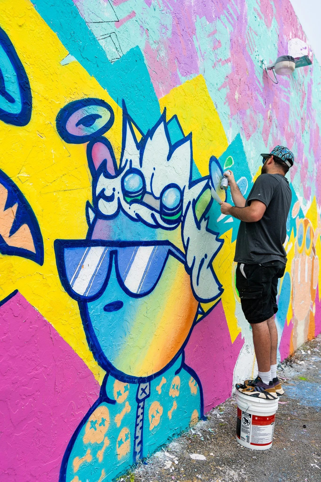 Roc Sol painting Quirkies NFT Mural in Wynwood Street Art
