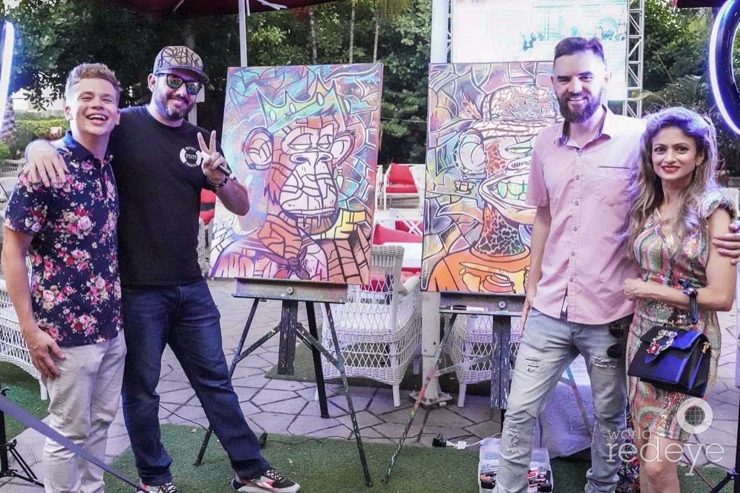 Roc Sol painting bored ape canvases live at Miami Web3 Happy Hour in Miami Beach Magic City Apes World Red Eye