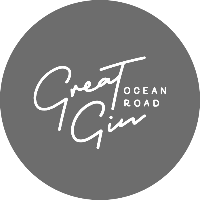 Logo for Great Ocean Road Gin with stylized text on a gray circular background.