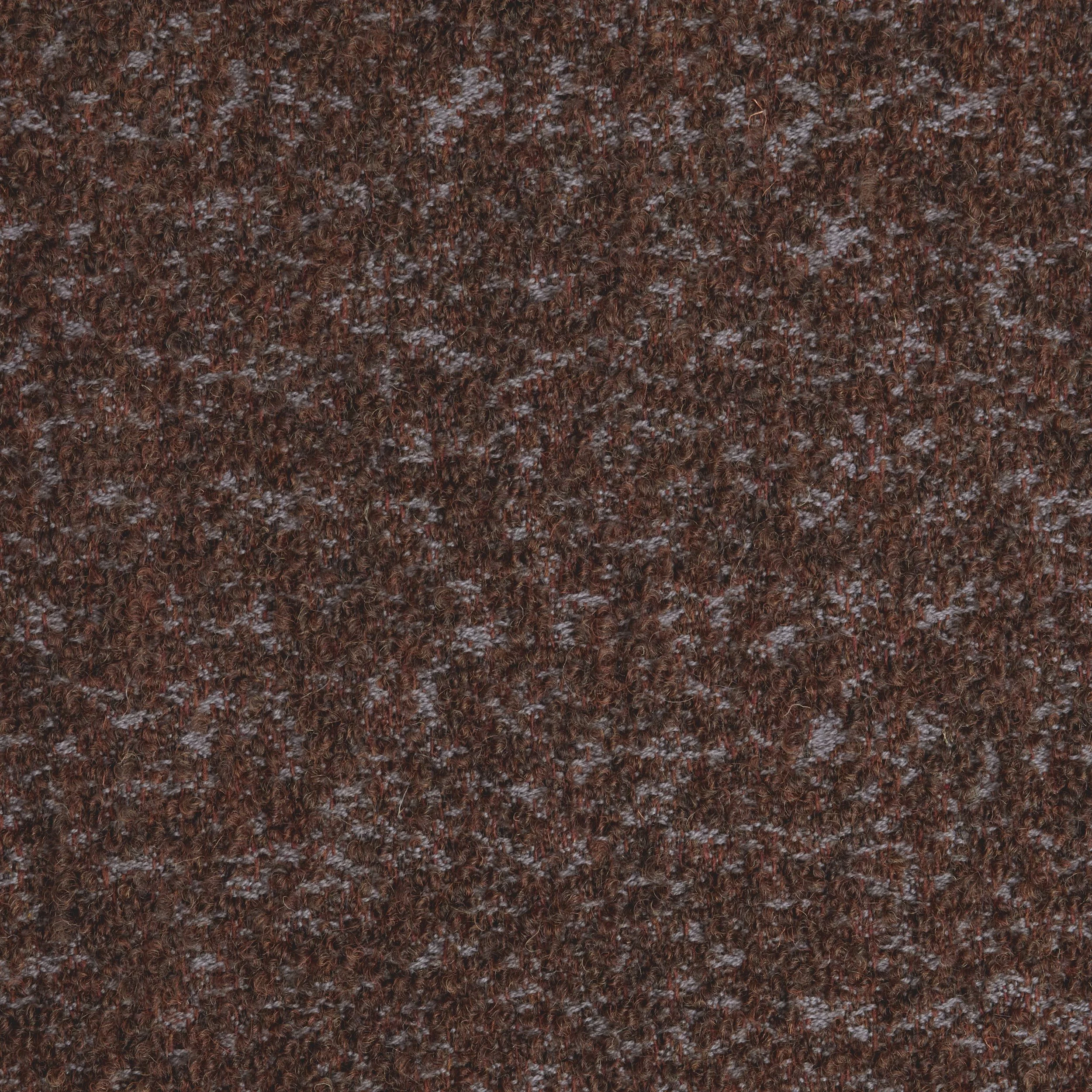Close-up of a textured, dark brown, granular surface.