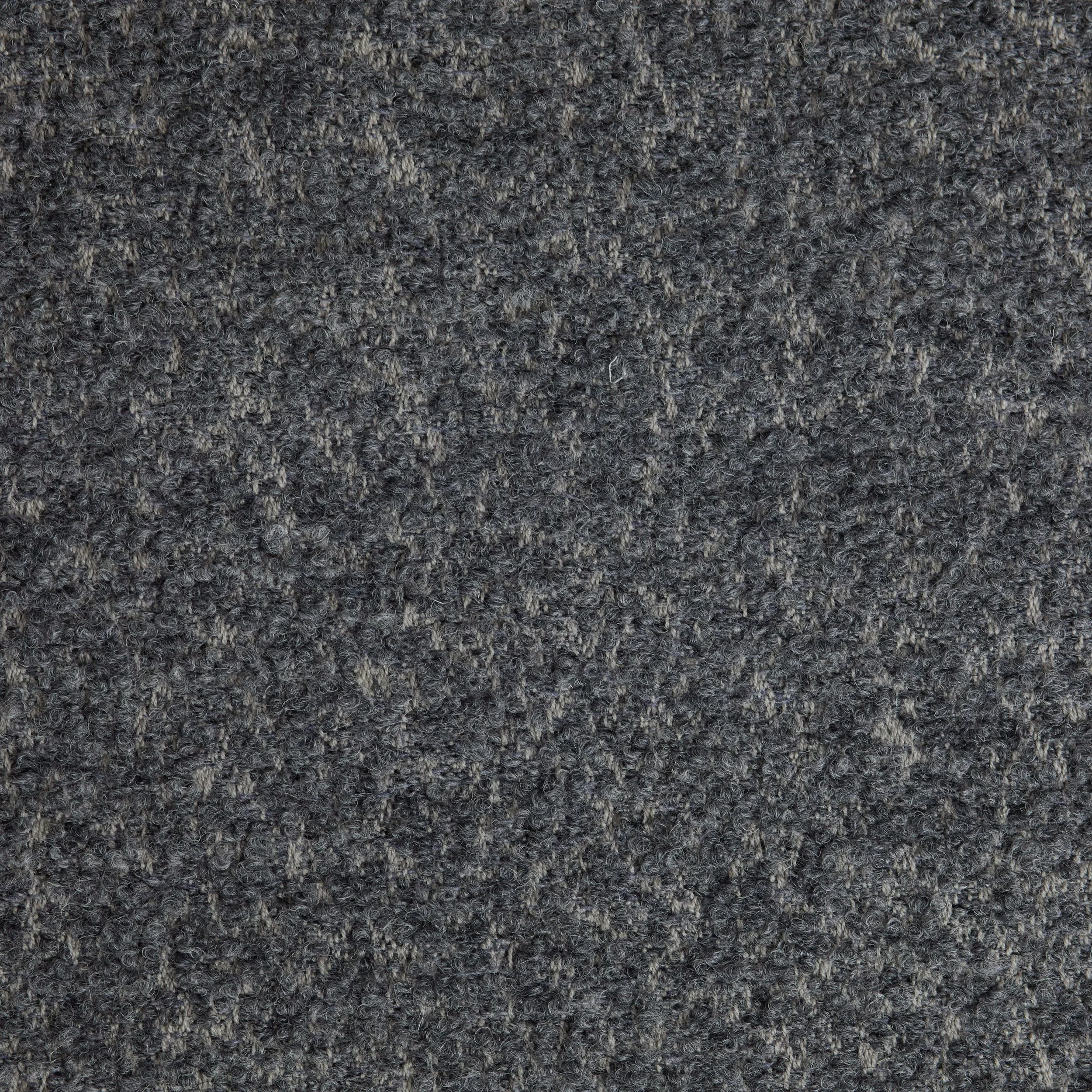 Close-up of a gray, textured carpet surface.
