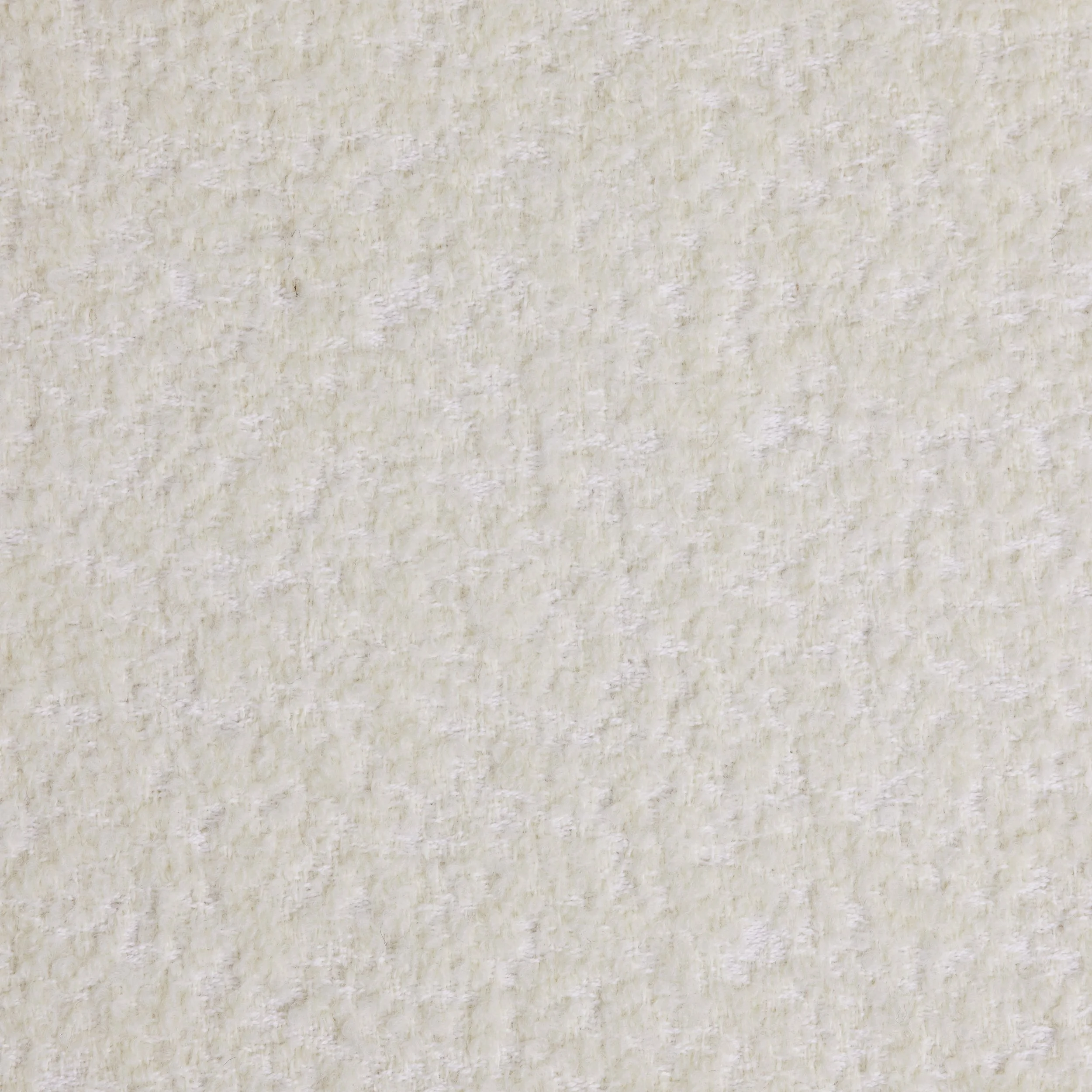 Close-up of a textured off-white or cream-colored wall or fabric surface