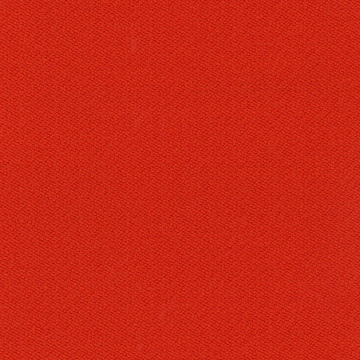 Close-up of a red fabric with a textured pattern.