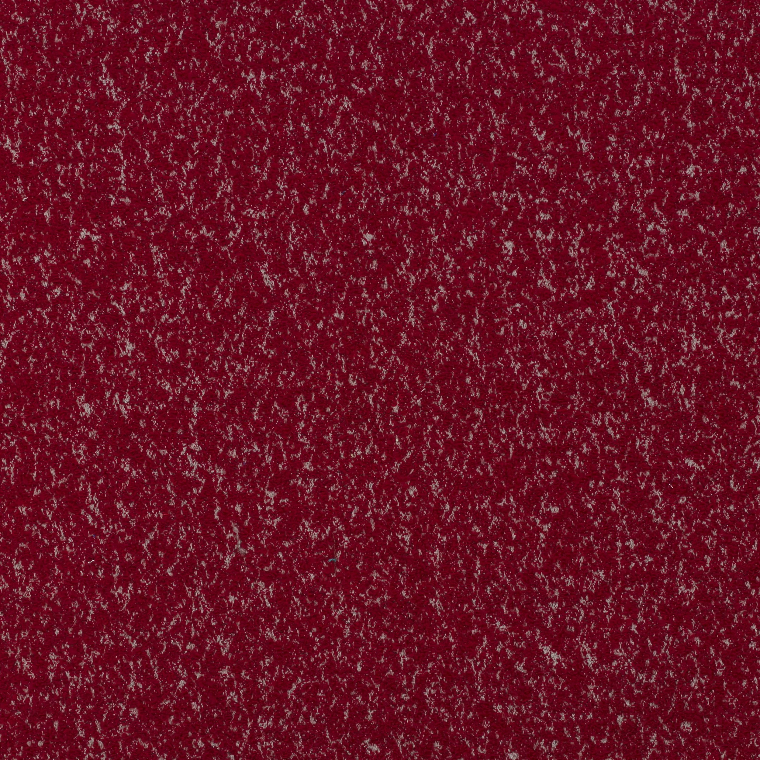 Close-up of a red textured surface, possibly a glittery or speckled material.
