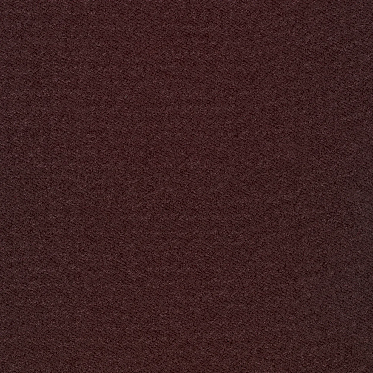 Close-up of a maroon-colored textured fabric.