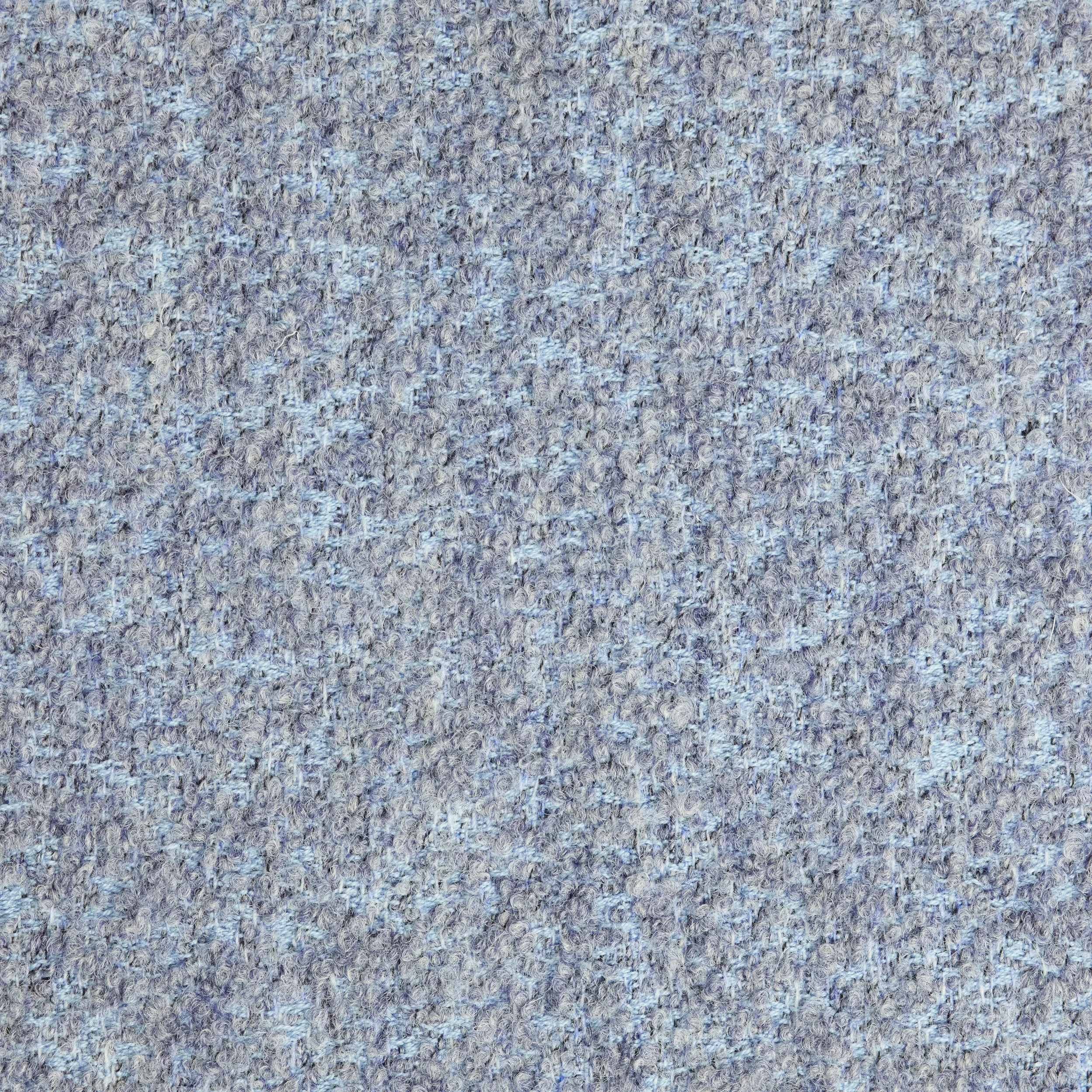 Close-up of a blue textured carpet.