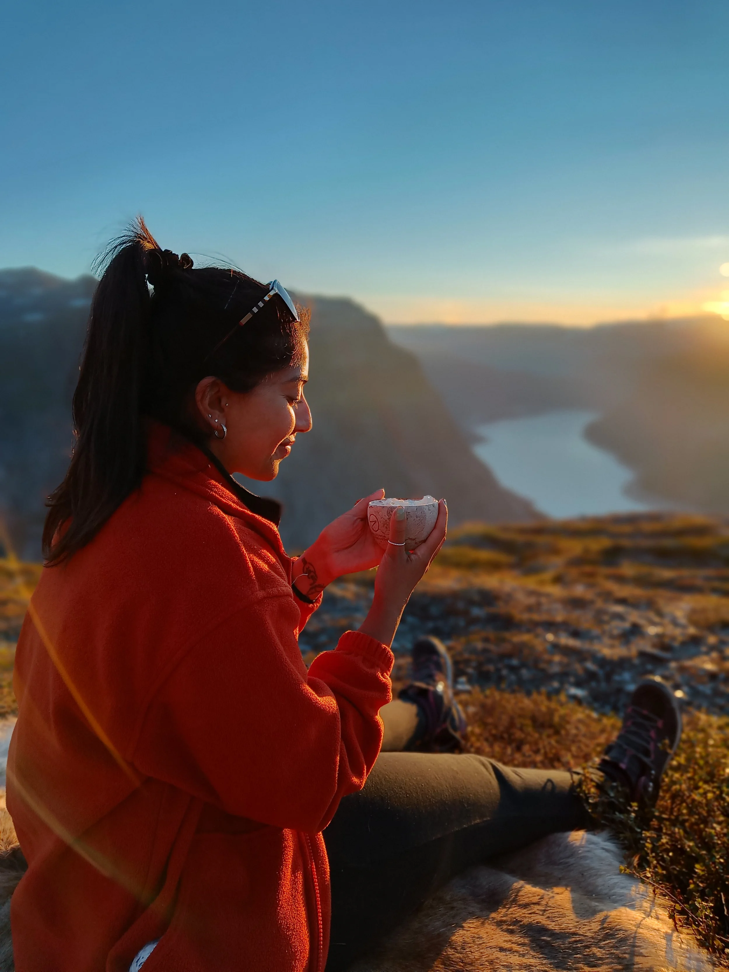 in our Trolltunga camp with a cup hot chocolate