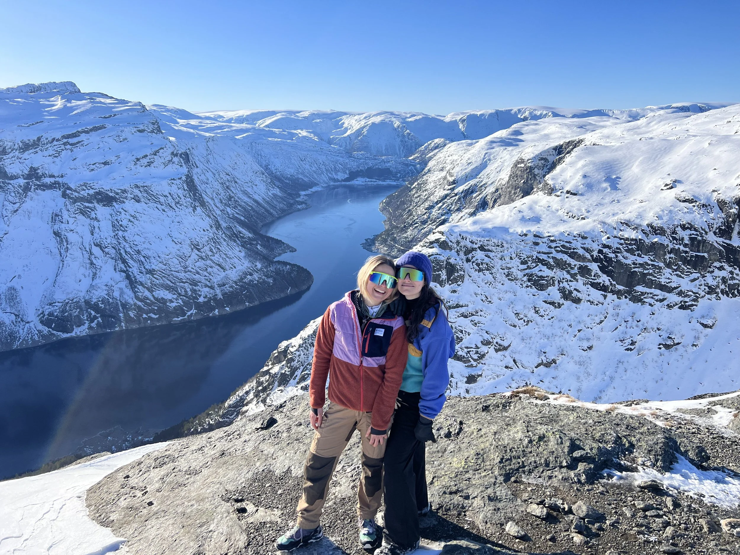 Happy people next to Trolltunga