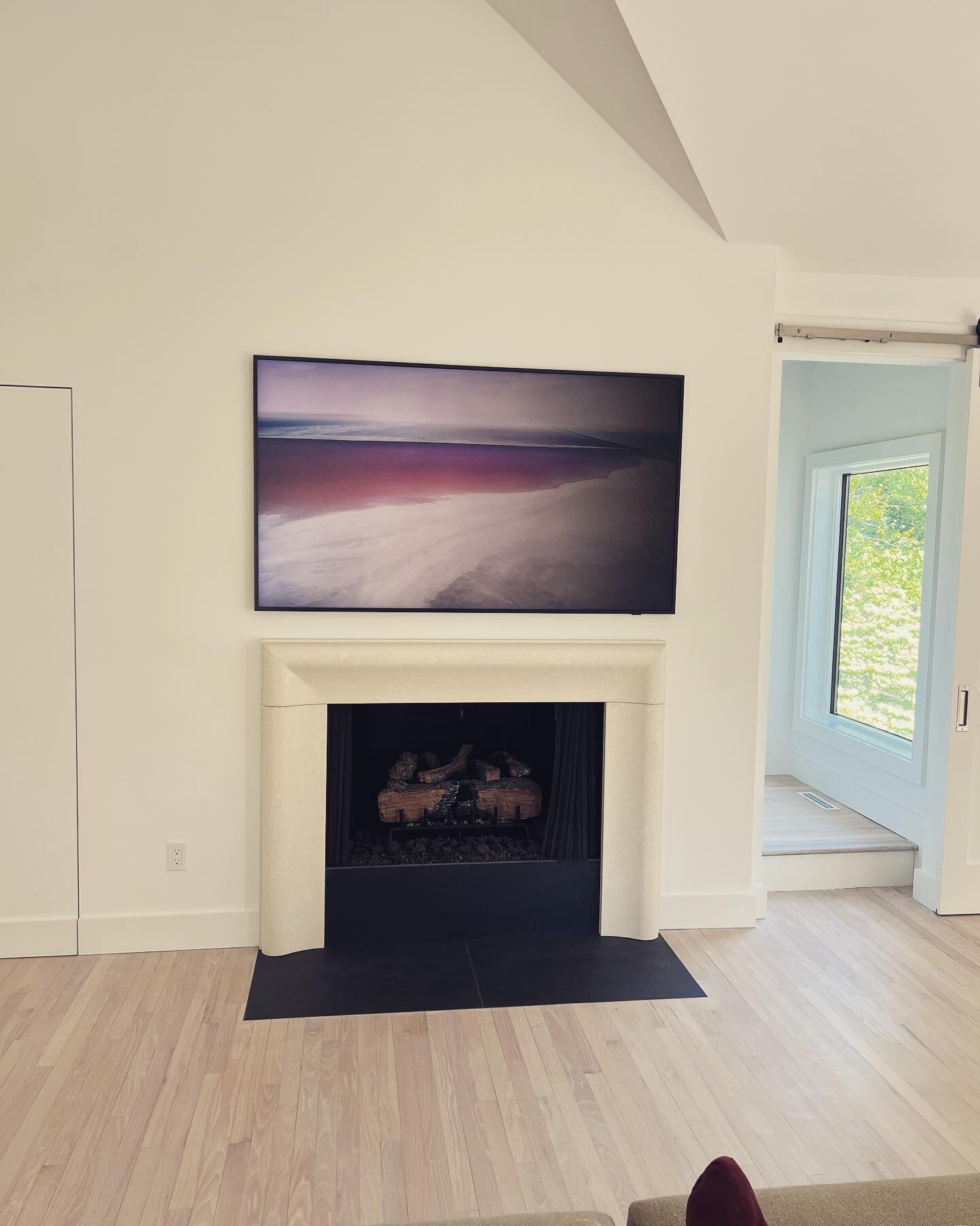 An @samsungtv with @sonancebeyondsound  invisible speakers to left and right of TV. Super clean look with stellar audio and video. Love this setup.