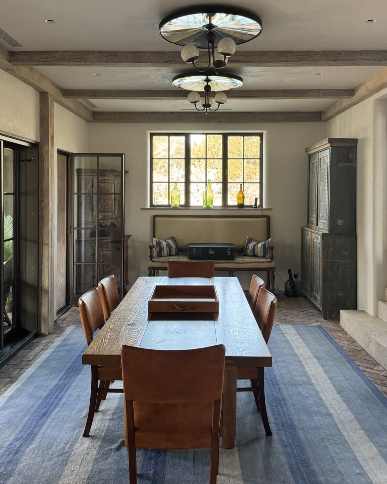 A quiet kind of luxury. This warm, light-filled space is layered with texture&mdash;from the rustic wood beams to the handwoven runner underfoot. Our subtly integrated downlights preserve the architectural charm while delivering modern performance, m