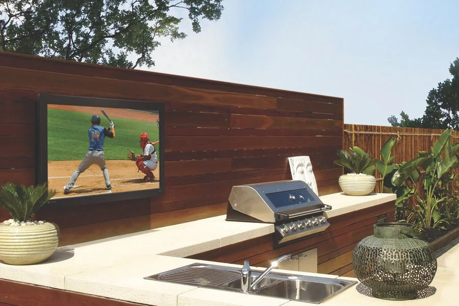 A well designed outdoor kitchen puts everything including the entertainment right at your fingertips