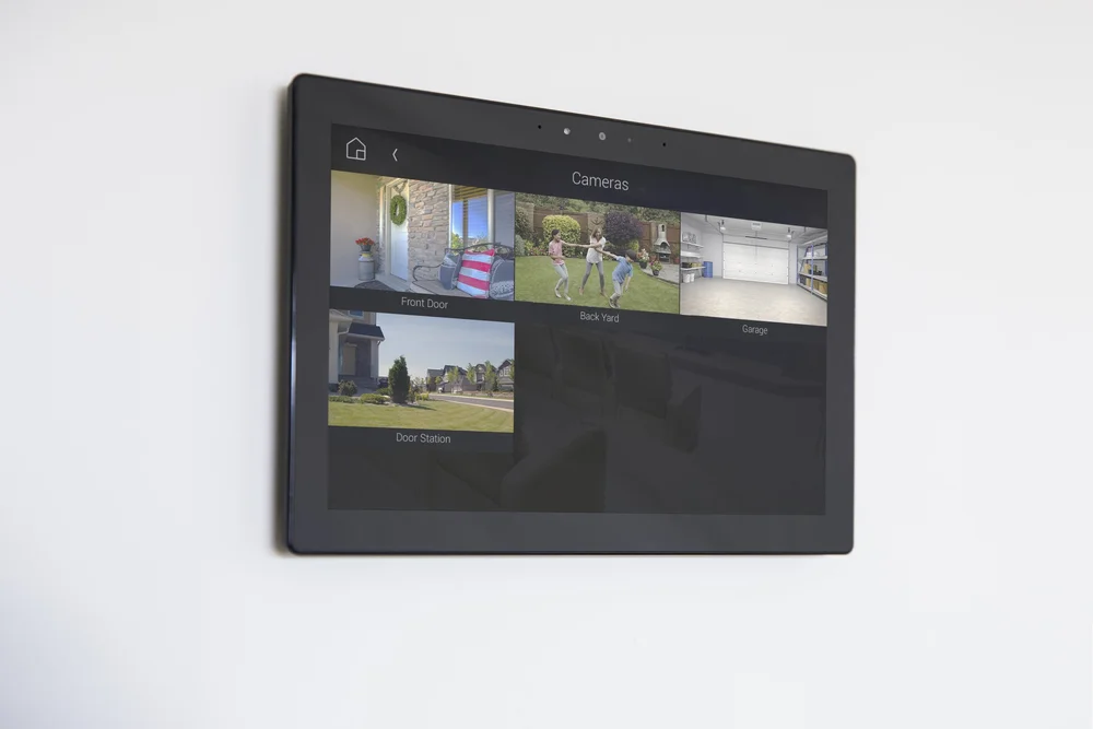 Control4 T5 Touchscreen flush mounted on a modern wall