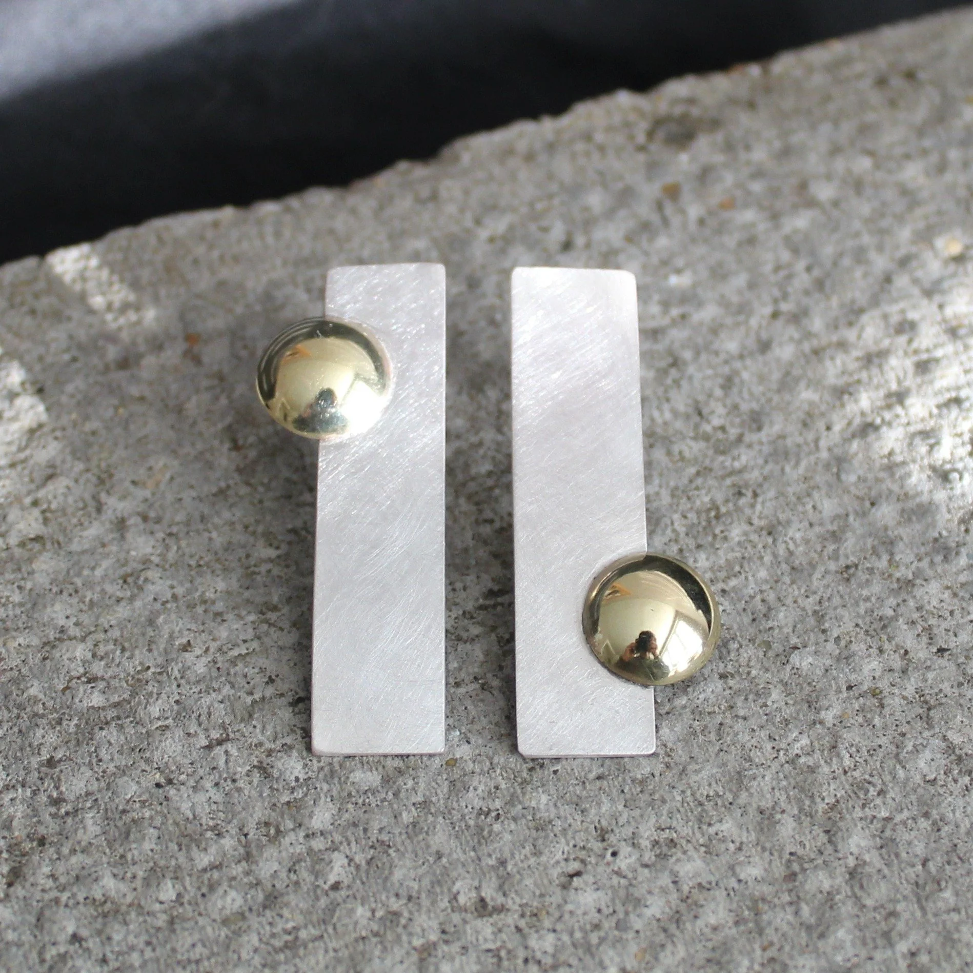 /// RECYCLED BRASS AND SILVER MODERNIST EARRINGS ///

These recycled silver and brass handmade earrings are a modernist style, and were inspired by sound mirrors - see also my left and right handed scoops created from the same inspiration.

The brass