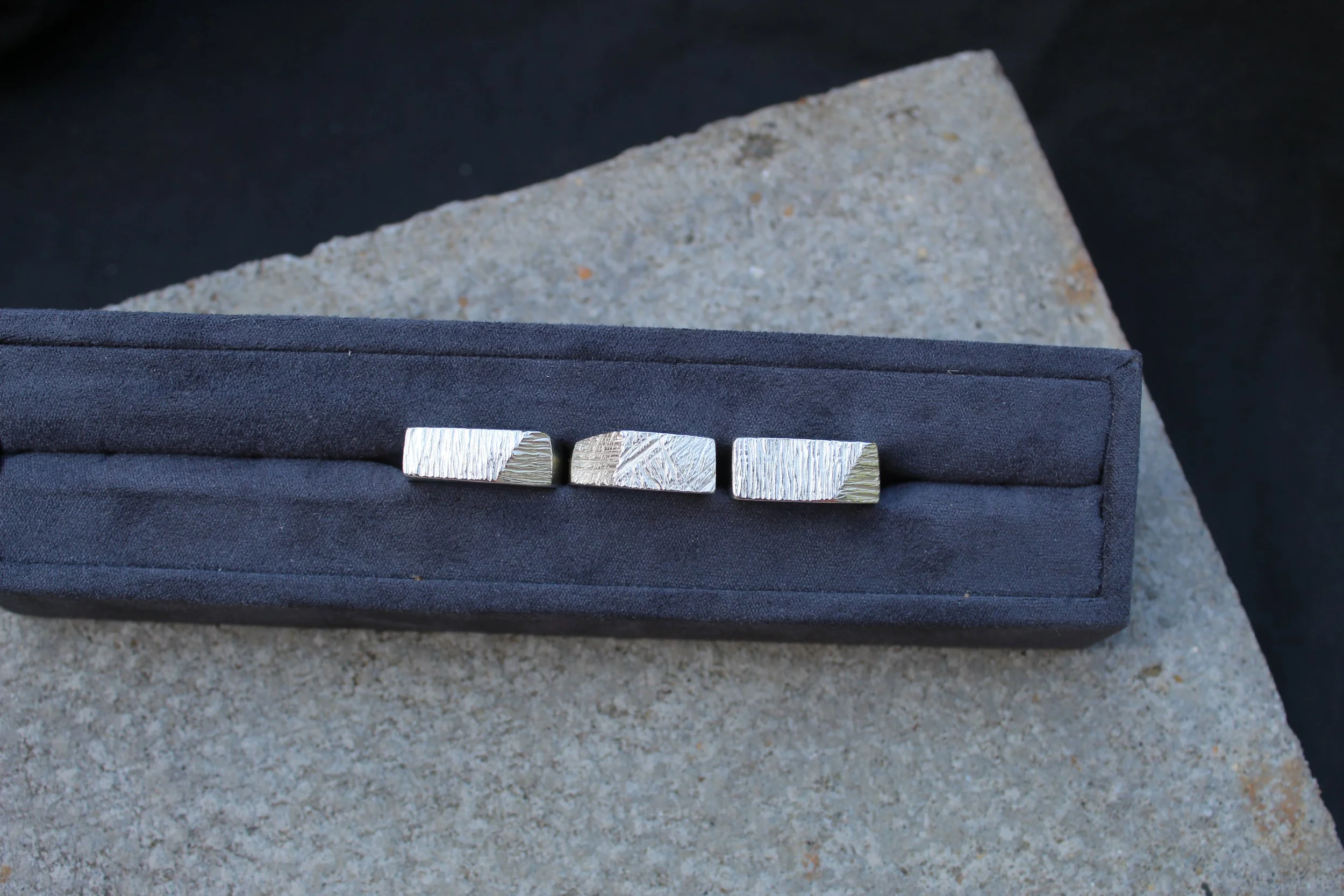 beton brut textured angles in holder.JPG