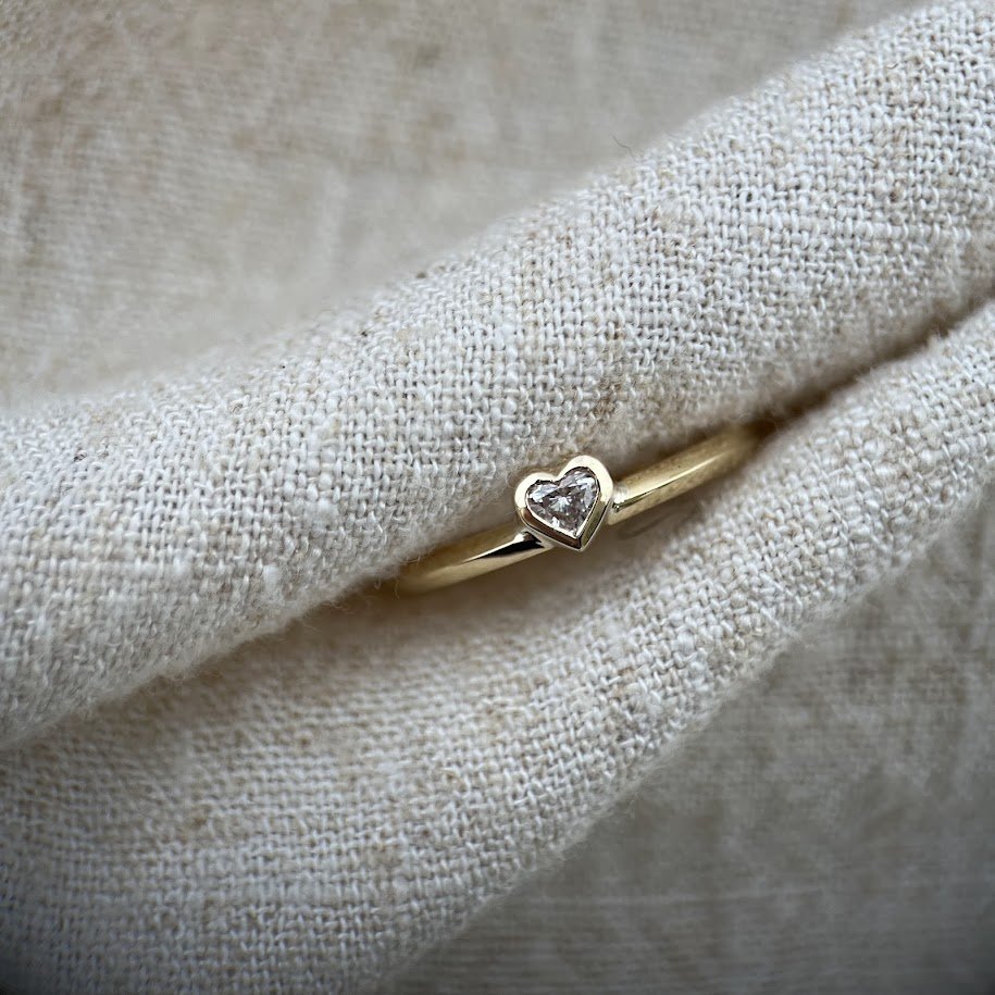  Natural genuine heart shape diamond set in yellow gold.