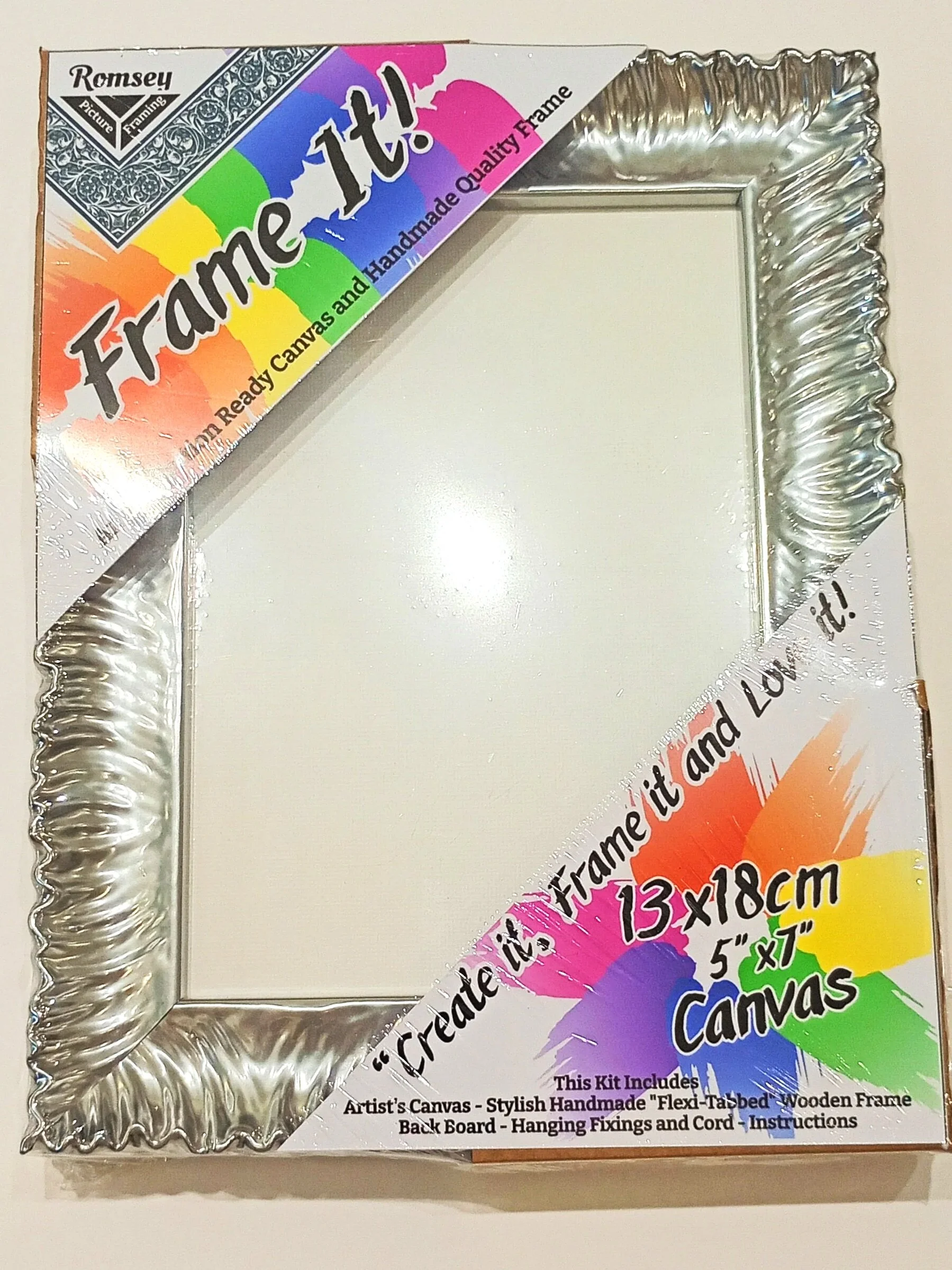A silver "Frame It!" packaged frame