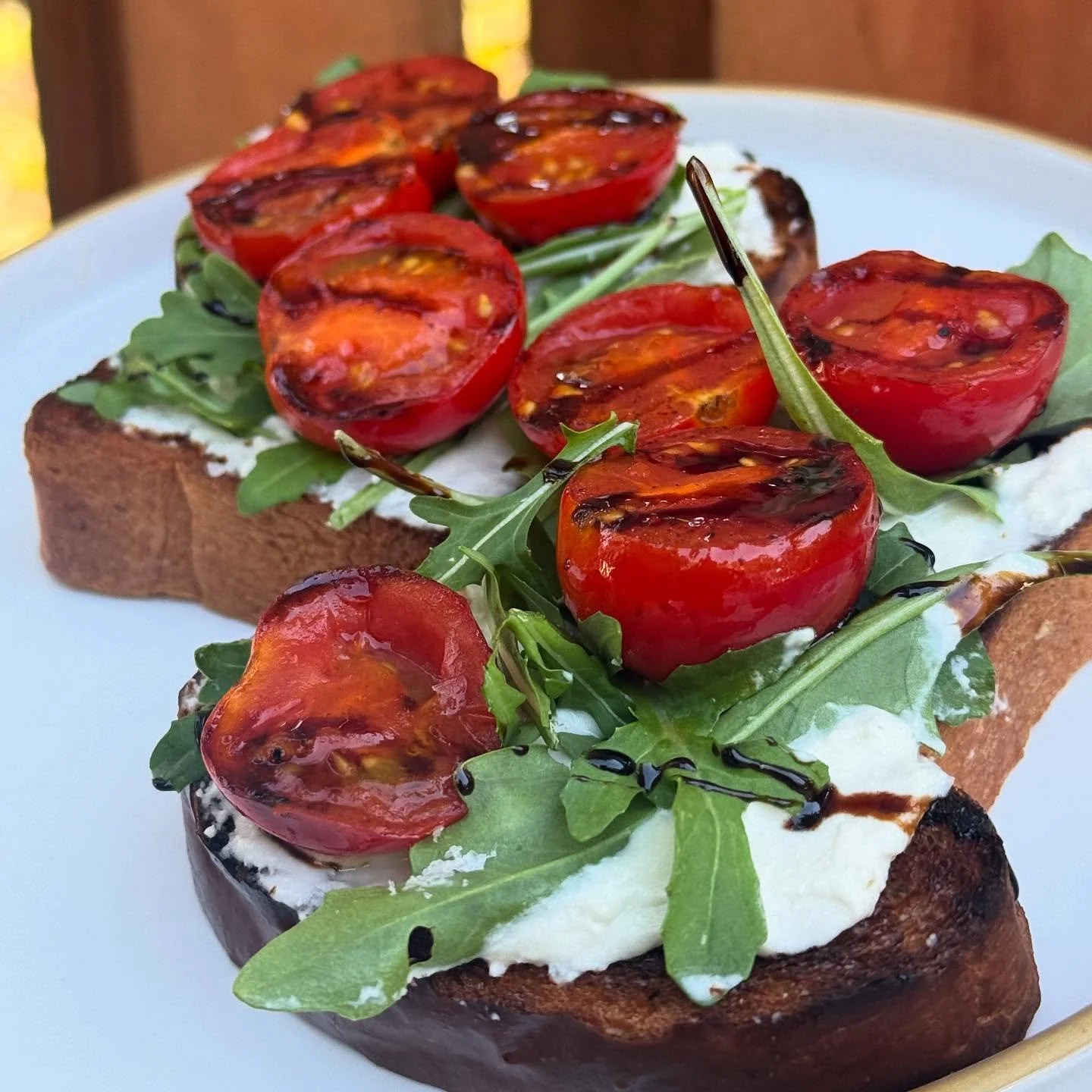 New special this weekend! Tomato toastie: @treeline_cheese ricotta, arugula, seared cherry tomatoes from @sunsproutfarm, topped with maldon salt and balsamic drizzle. 🍅
