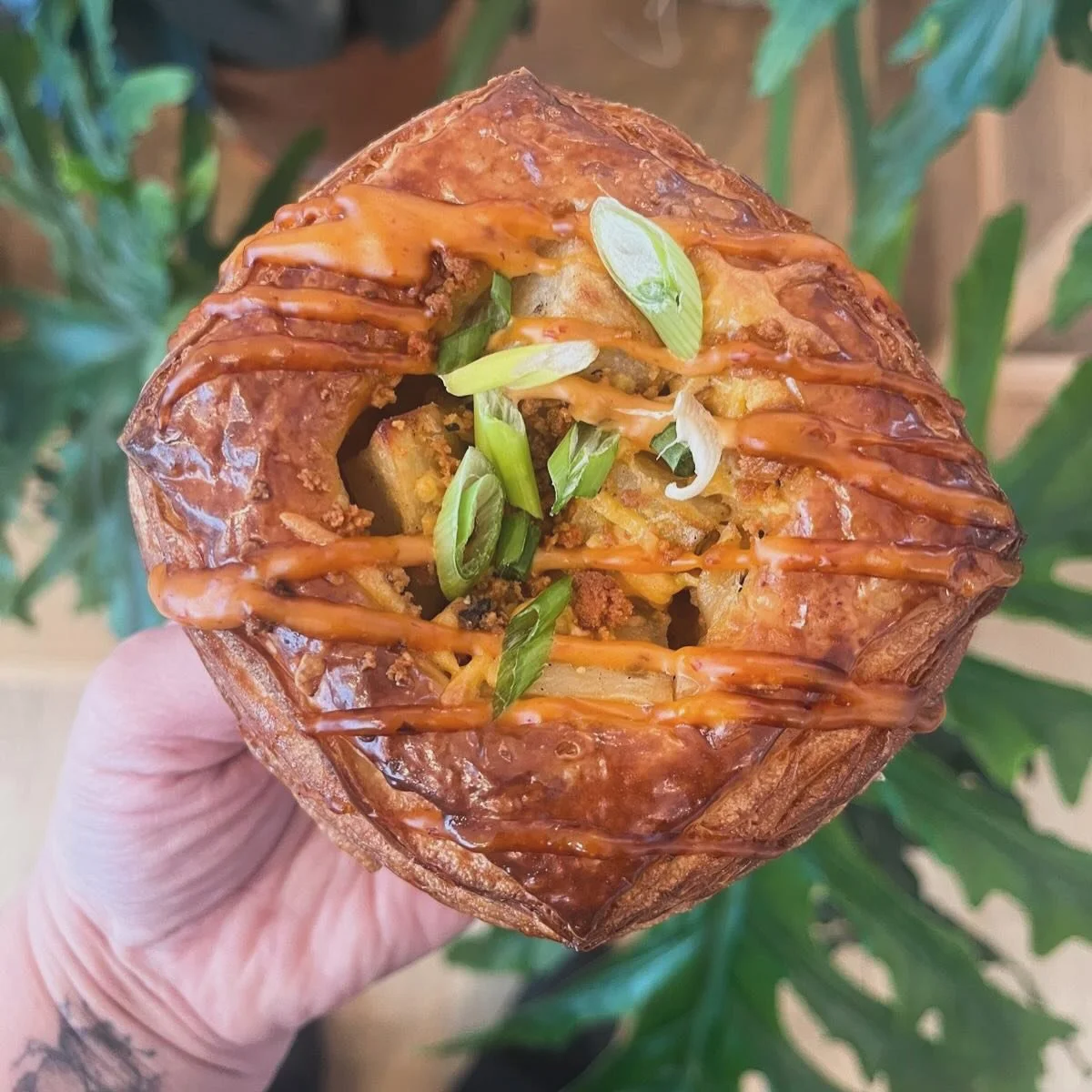 Meet our newest savory pastry&hellip;the loaded potato danish! 🥐 🥔 

This tasty [not so] little snack is filled with paprika b&eacute;chamel, roasted breakfast potatoes, @thrillingfoods crumbles, chipotle mayo, and topped with scallions. 

Get it t