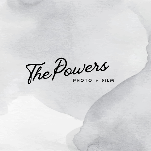 A minimalist cover design with a light gray watercolor background and black cursive text that reads 'The Powers' with smaller text underneath saying 'Photo + Film'.