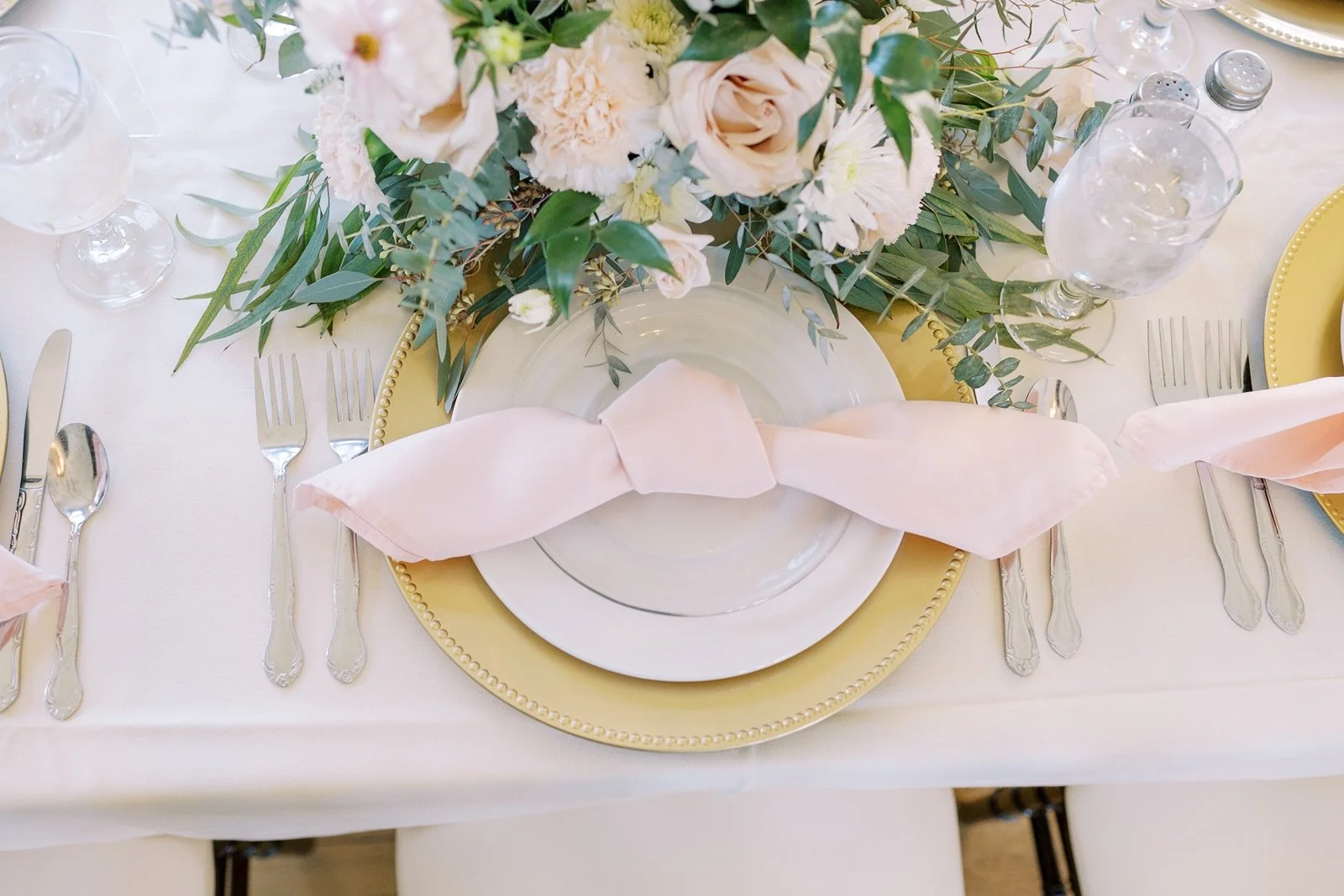 Blush floral centerpiece at Venue3Two wedding reception
