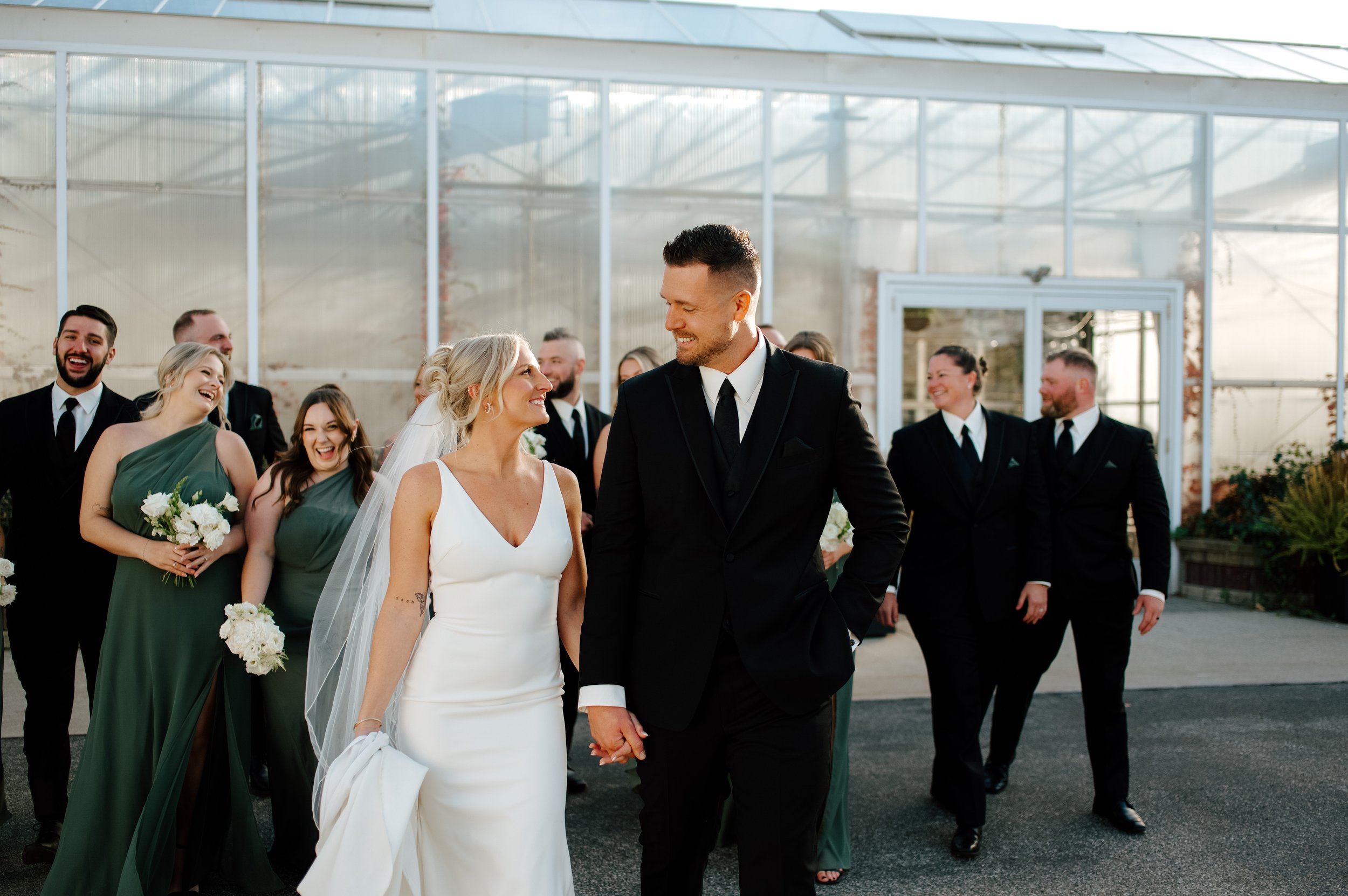 Primary and attendant bouquets in a classic green and white palette at a Michigan wedding