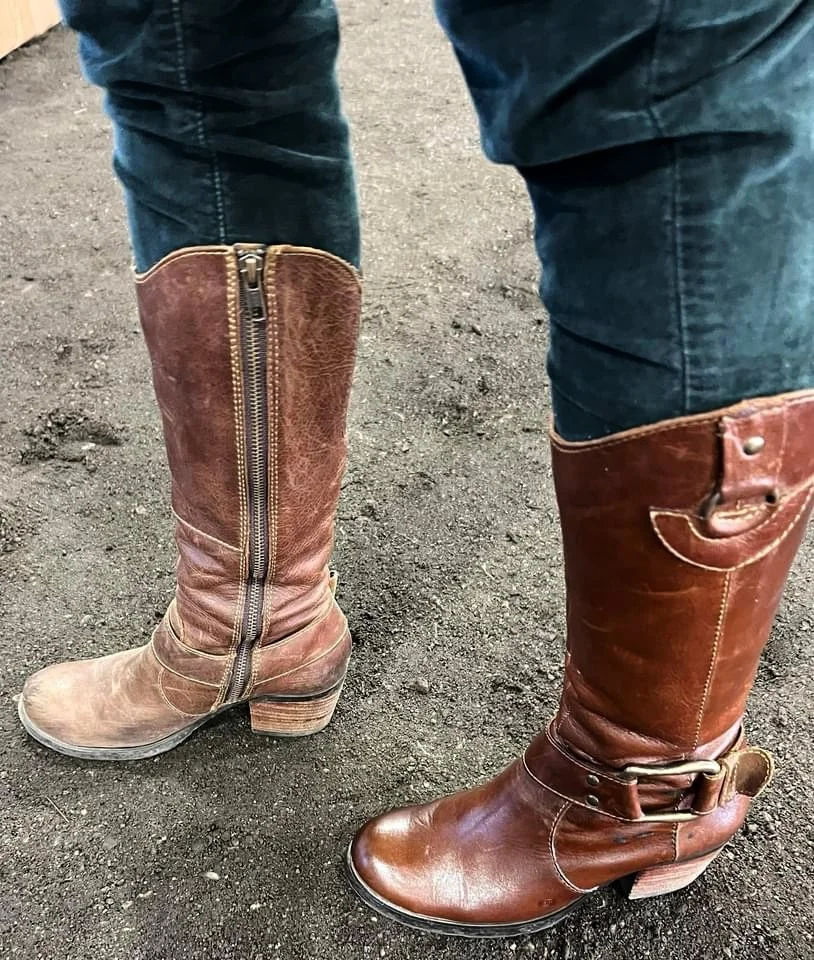 A pair of knee high boots being worn, with one boot looking dry and scuffed, and the other boot looking conditioned, supple and lusterious after an application of Healthy Leather.