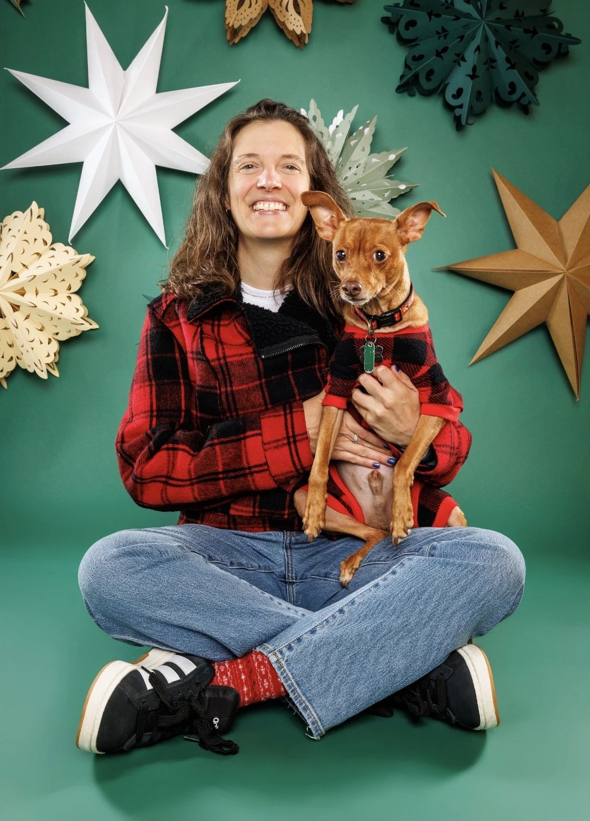 a girl with her dog posing for a photo
