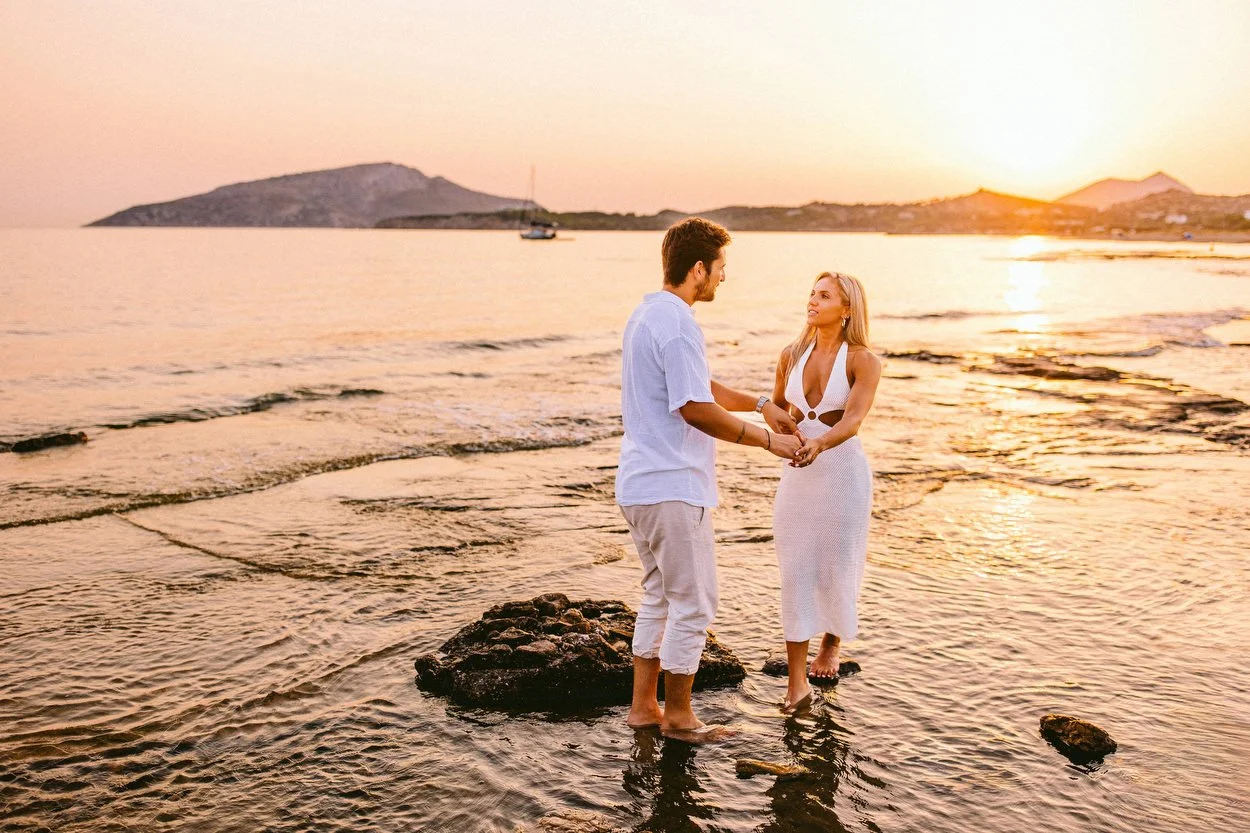 Couple in the water, walking away