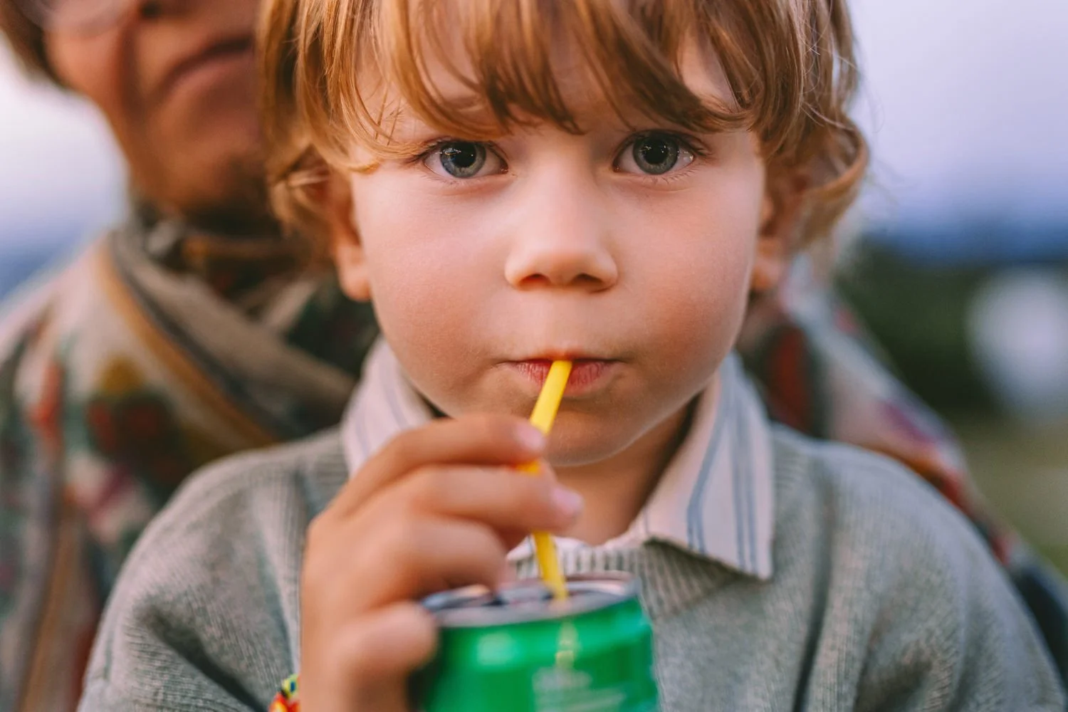 boy drinking soft drink 