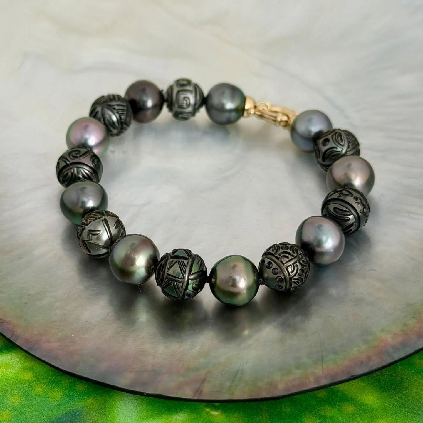 We create jewelry with intention and purpose.
Our designs are inspired by Polynesian symbols, the ocean, and the deep cultural meanings carried through our islands.

This carved Tahitian pearl strand bracelet is one expression of that inspiration &md