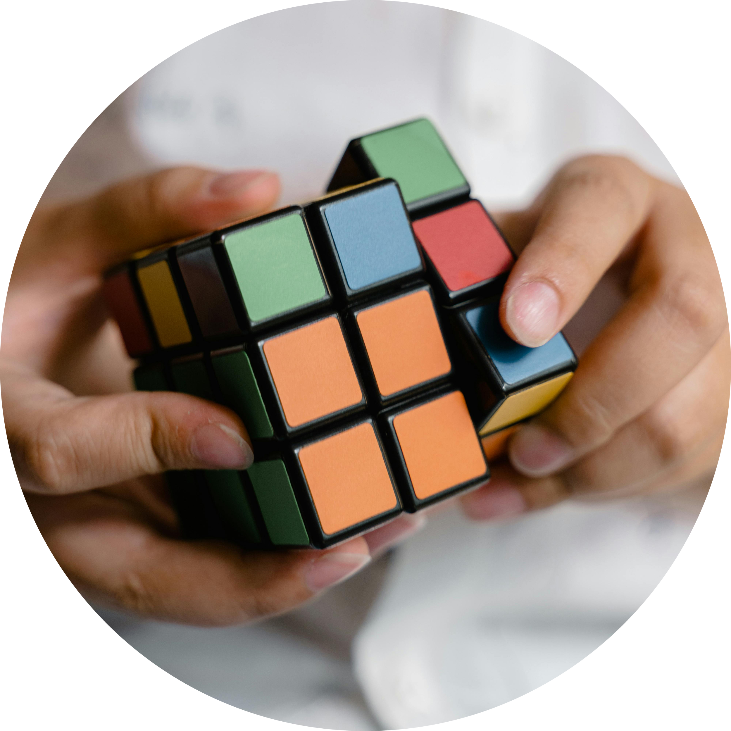 Hands solving Rubik's Cube