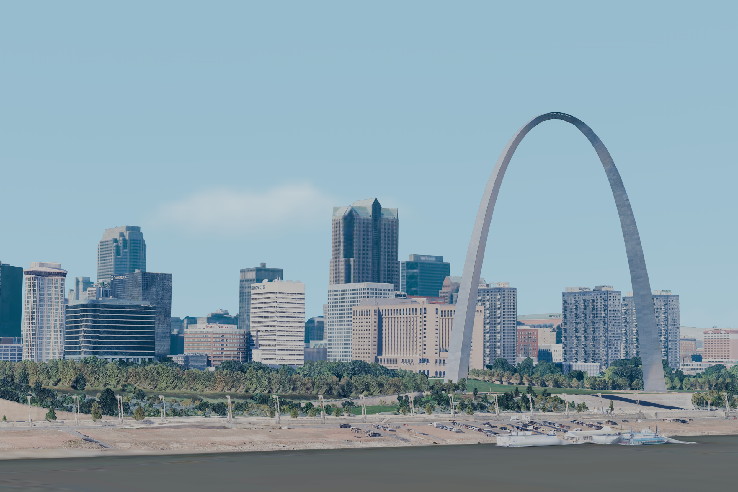 View of the St. Louis skyline featuring the Gateway Arch, with modern skyscrapers under a clear blue sky and green landscape in the foreground.