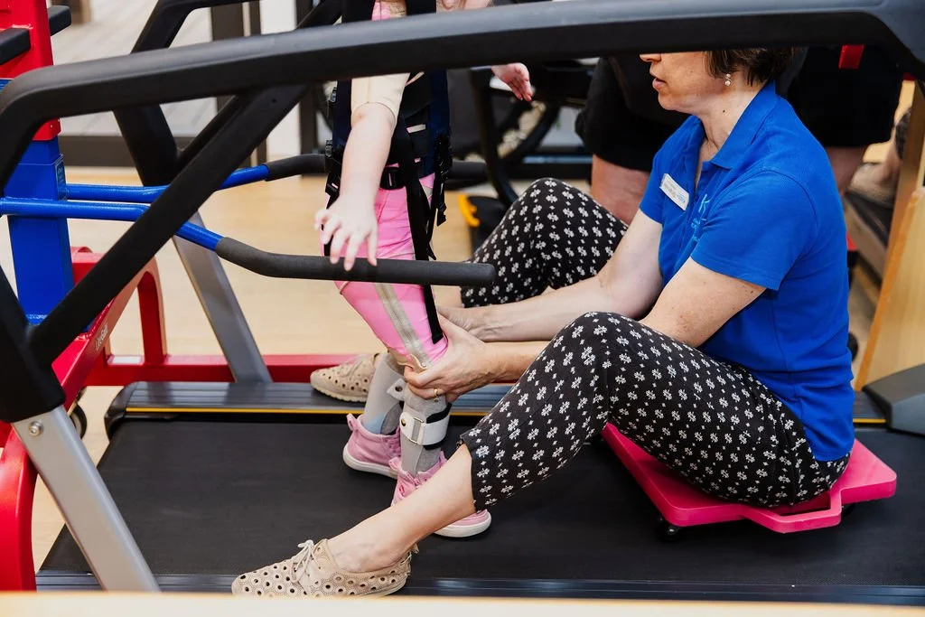 child in hoist in physio session at kids plus geelong