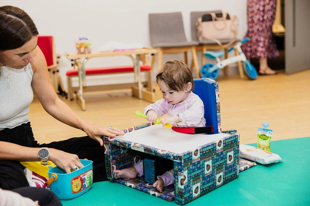 infant sitting at soft table during kids plus occupational therapy (OT) NDIS session at Kids+ Geelong