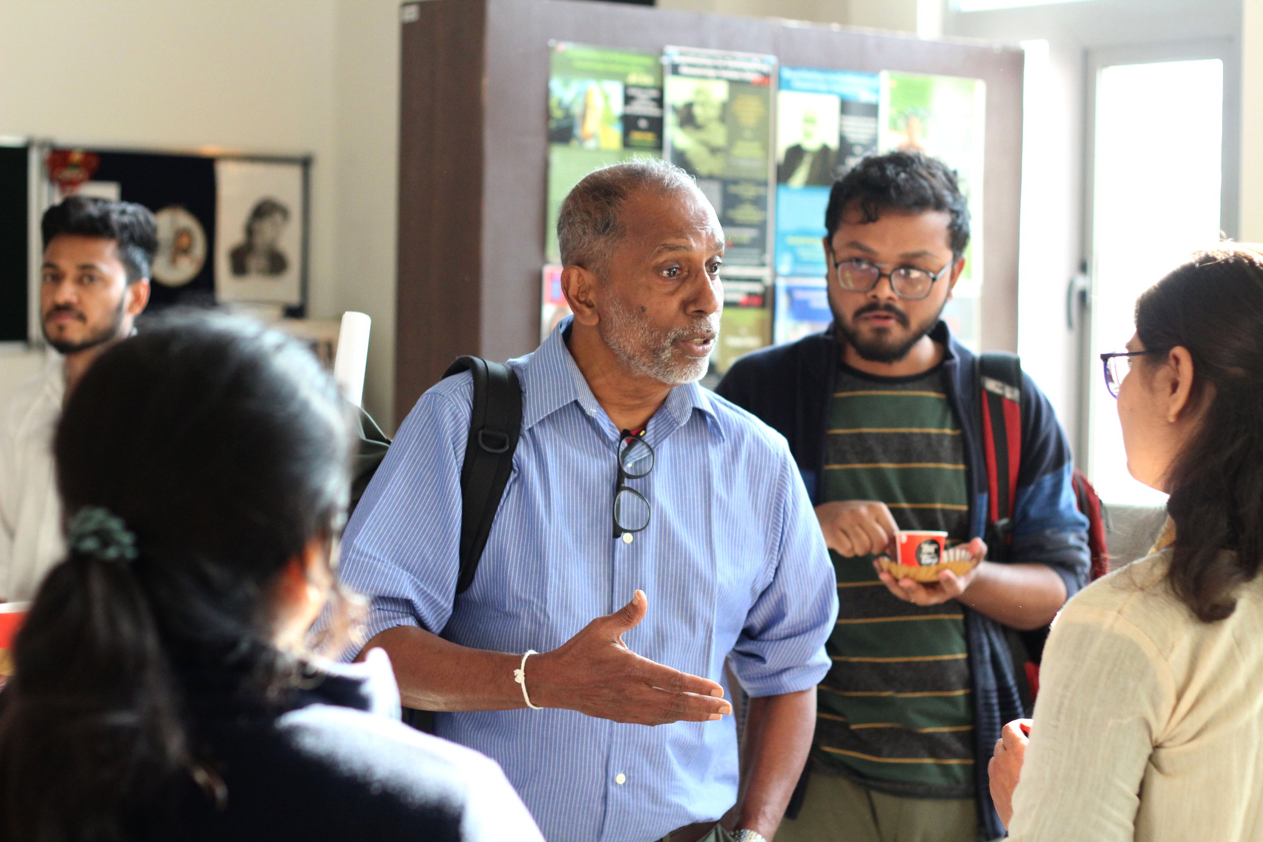 Nihal Perera converses with students after his lecture.