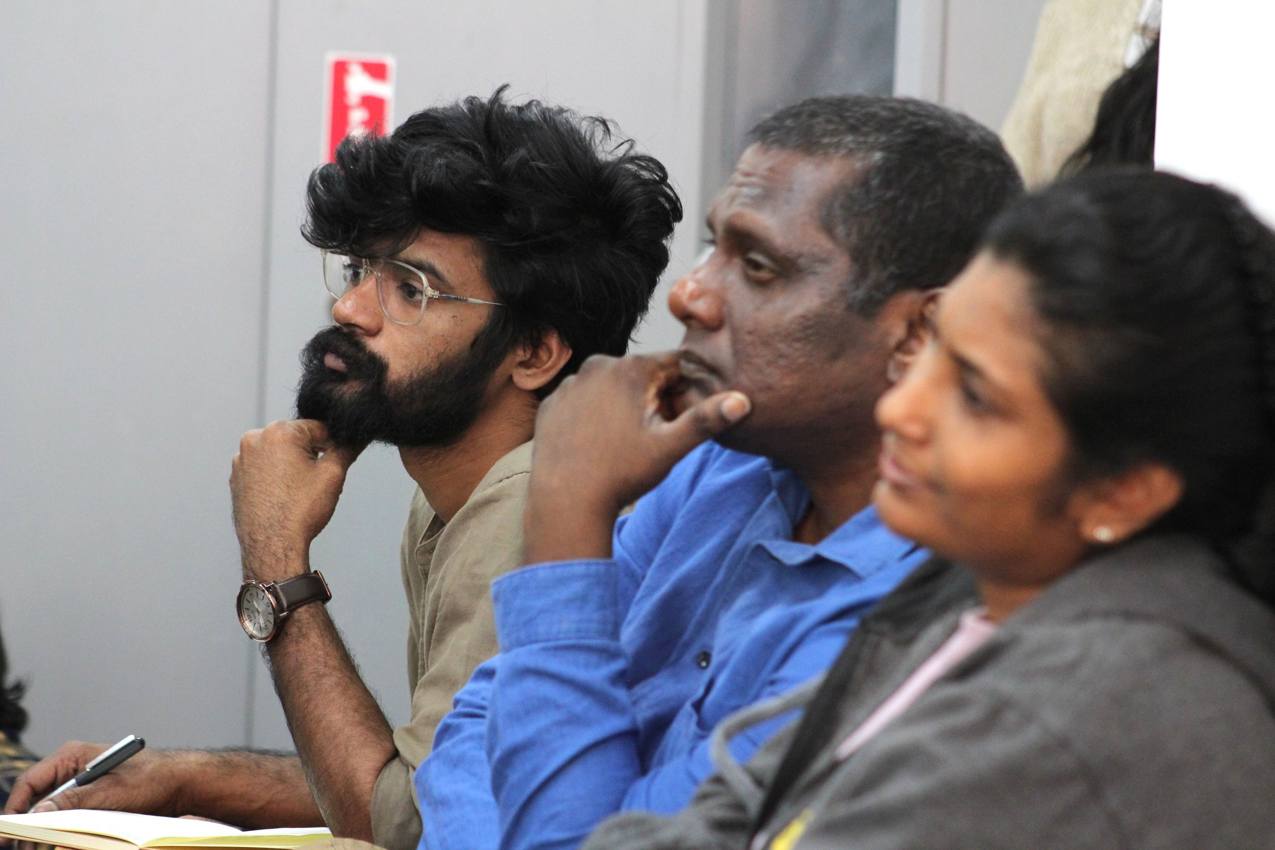 Attendees of Nihal Perera's lecture listen in.