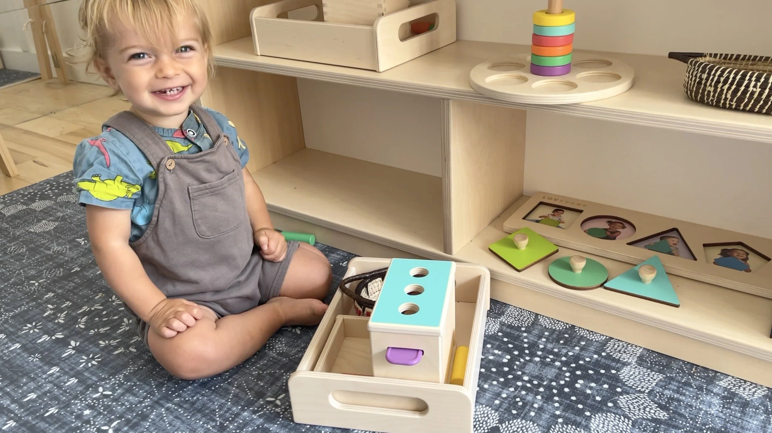 The peg drop has been a favorite Montessori material at 15 months