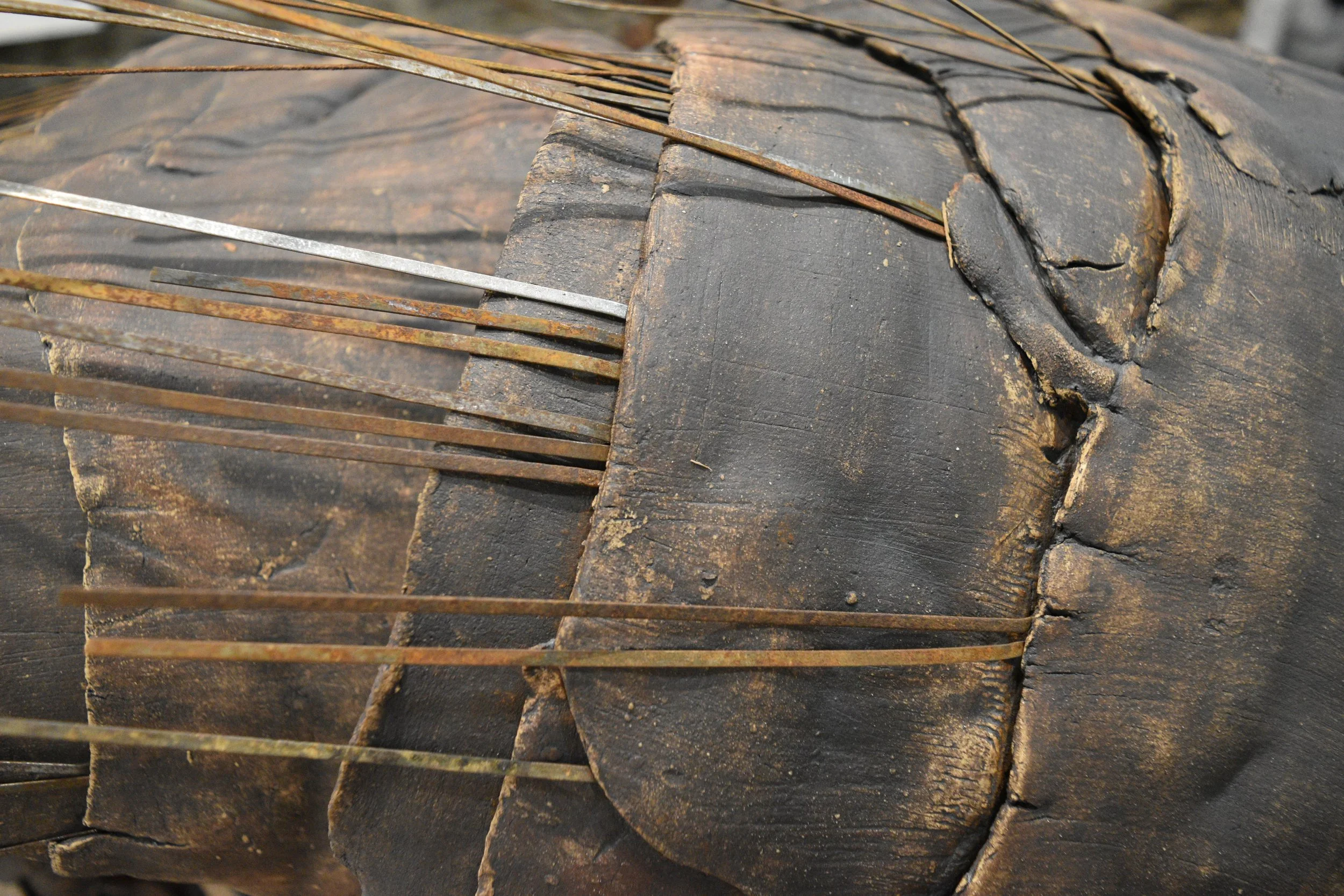 Amphipoda, 2021.
Stoneware, oxides, street sweeper bristles, rebar, cork. 34 × 56 × 24 in.