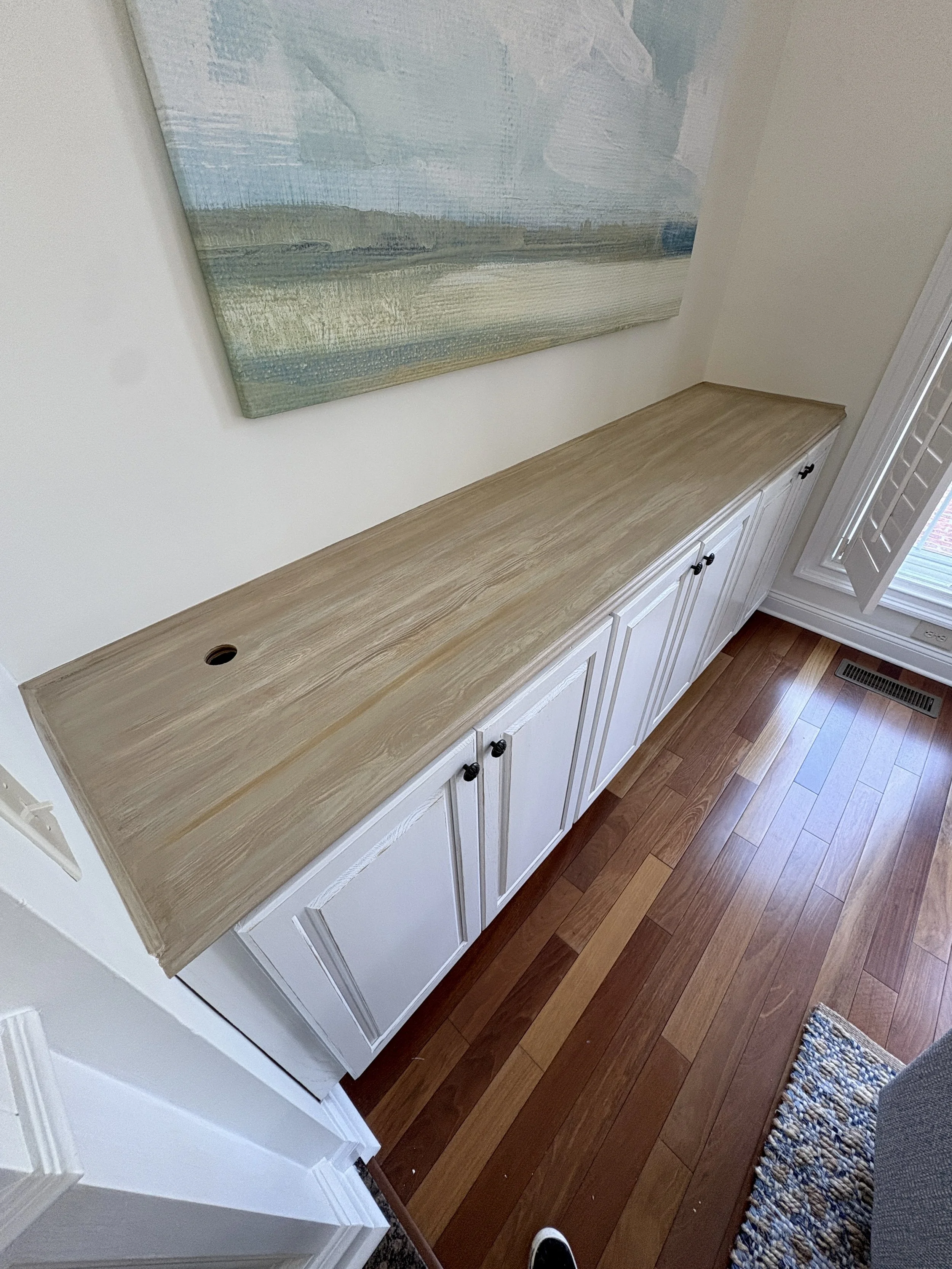This all white cabinet was transformed by faux graining JUST the top. Look how warm & rich it looks now. Sometimes it's just in the details that make a big difference. 