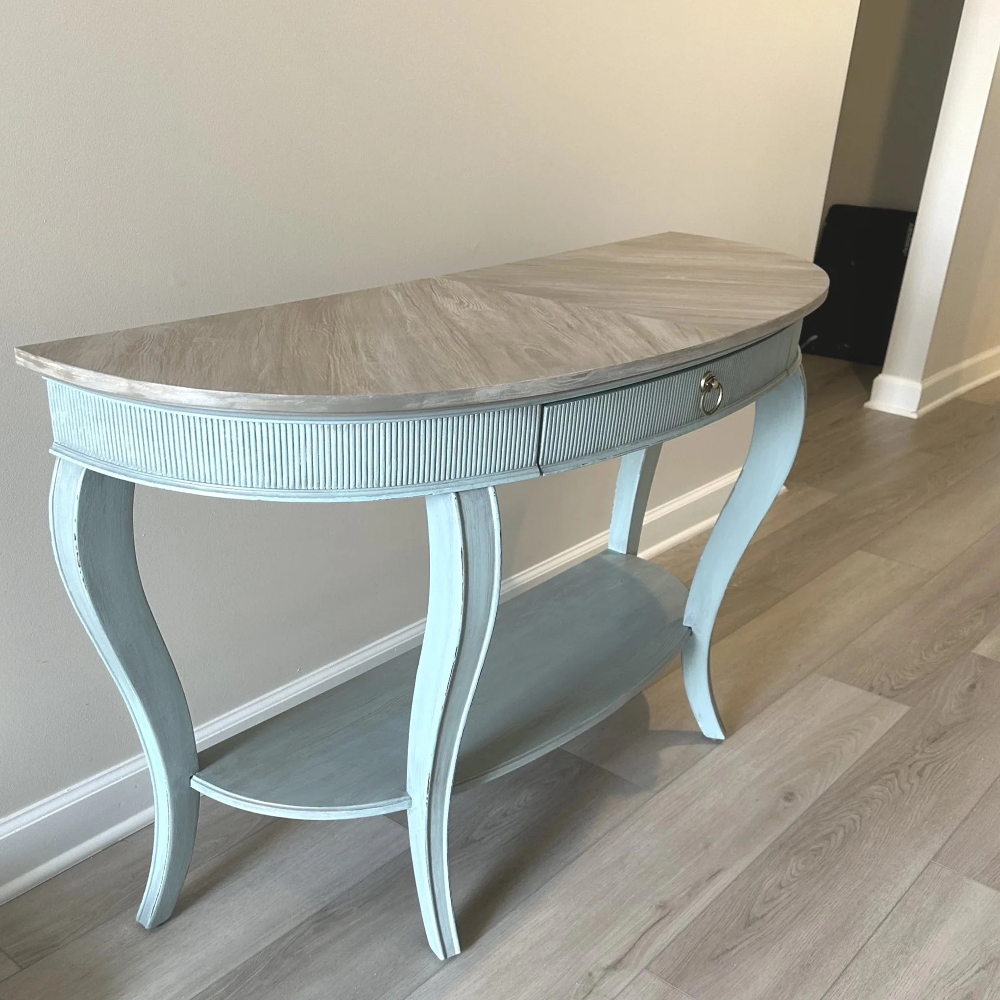 Hand painted table in tones of soft teal with antique faux with faux grain done in diagonal pattern. Perfect coastal look!