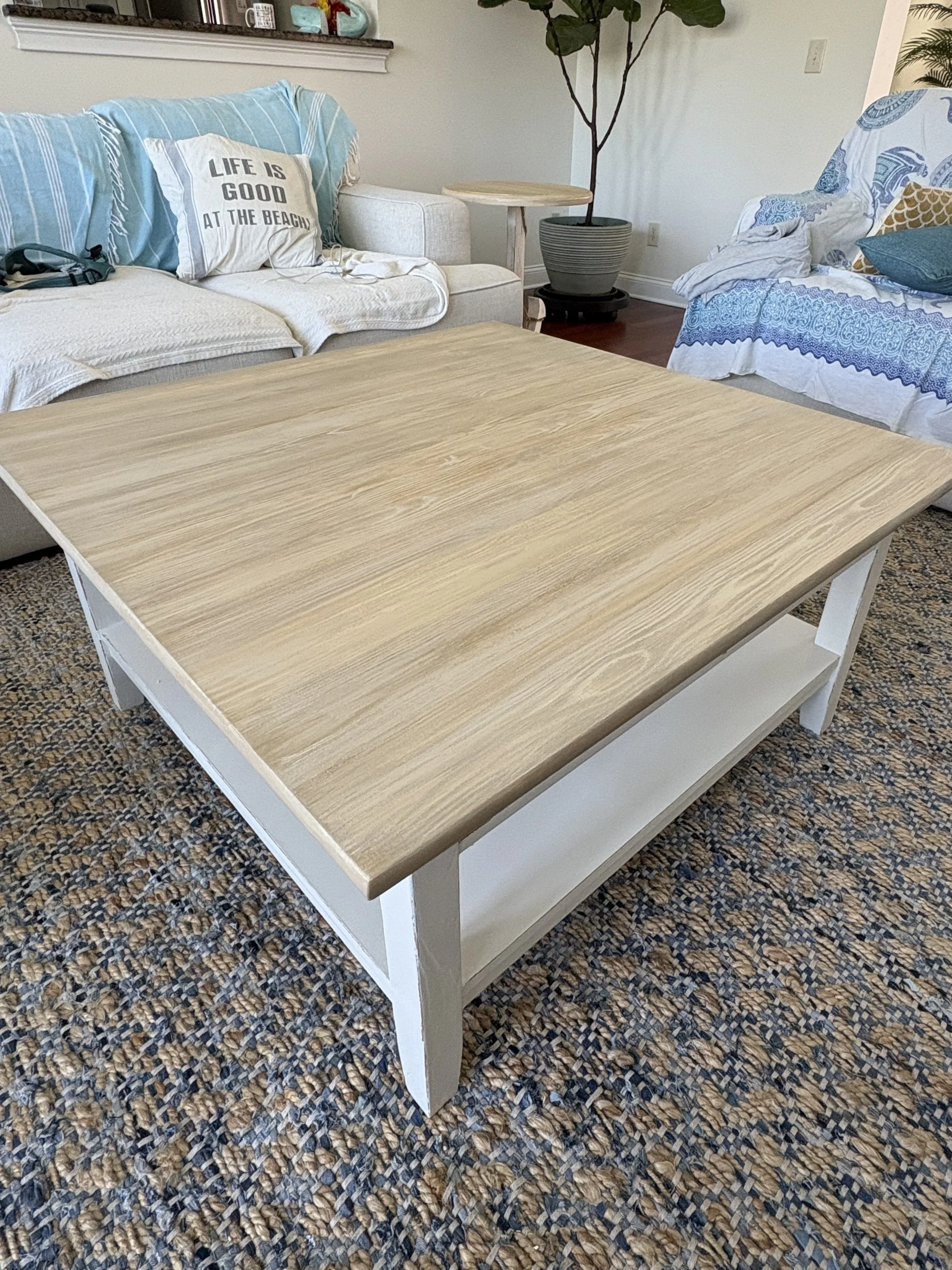 Sometimes it's in the details that transforms a piece. Faux graining JUST the top gave this all white coffee table a more coastal feel.