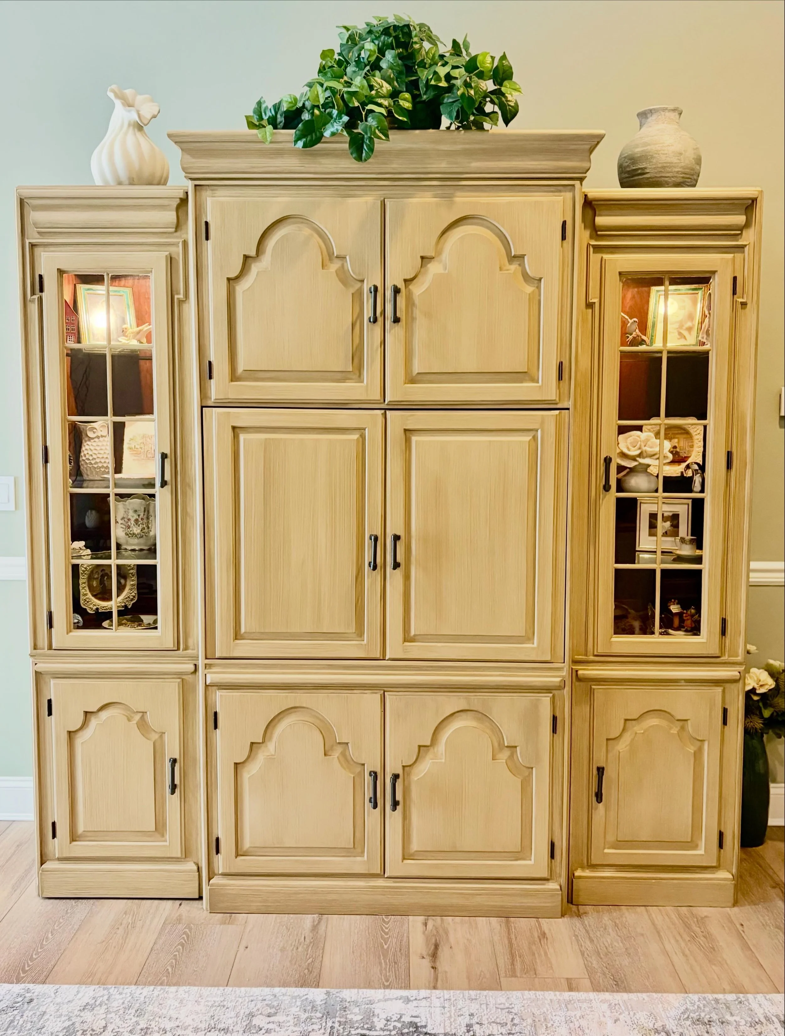 Dark wood wall unit transformed with custom colored base coat with dry brush effect!
All furniture is painted is primed & painted in Advance Benjamin Paint for lasting durability.