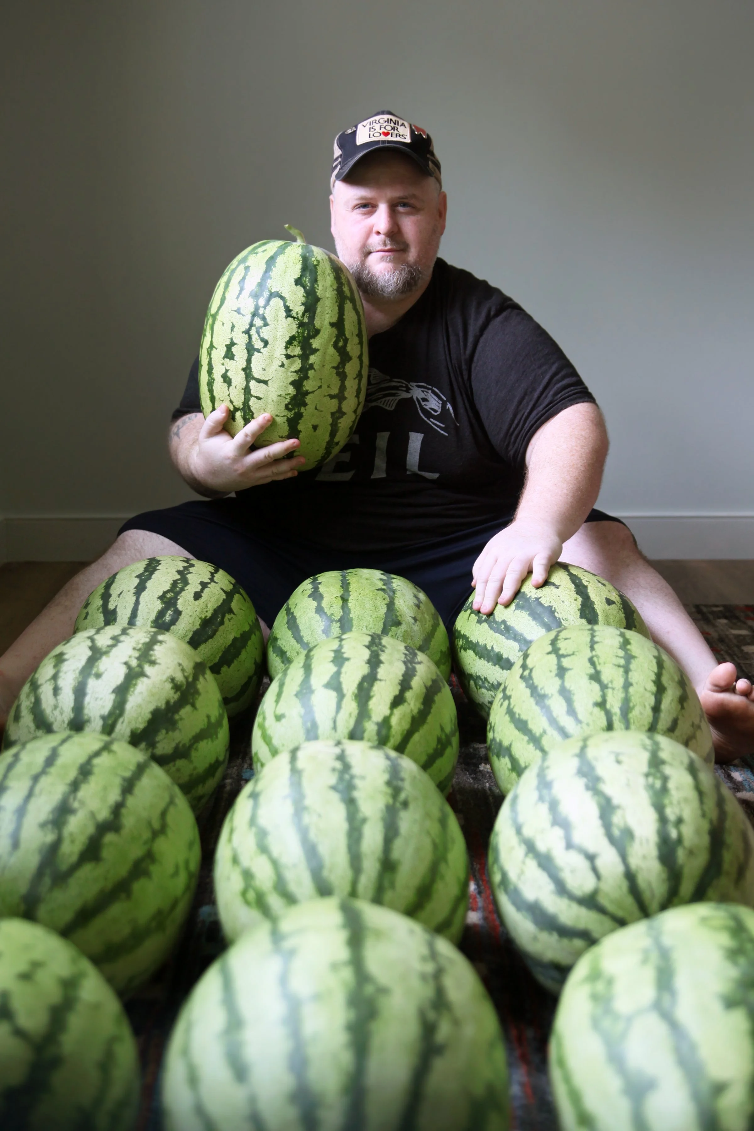 Joshua Fitzwater with heirloom watermelons